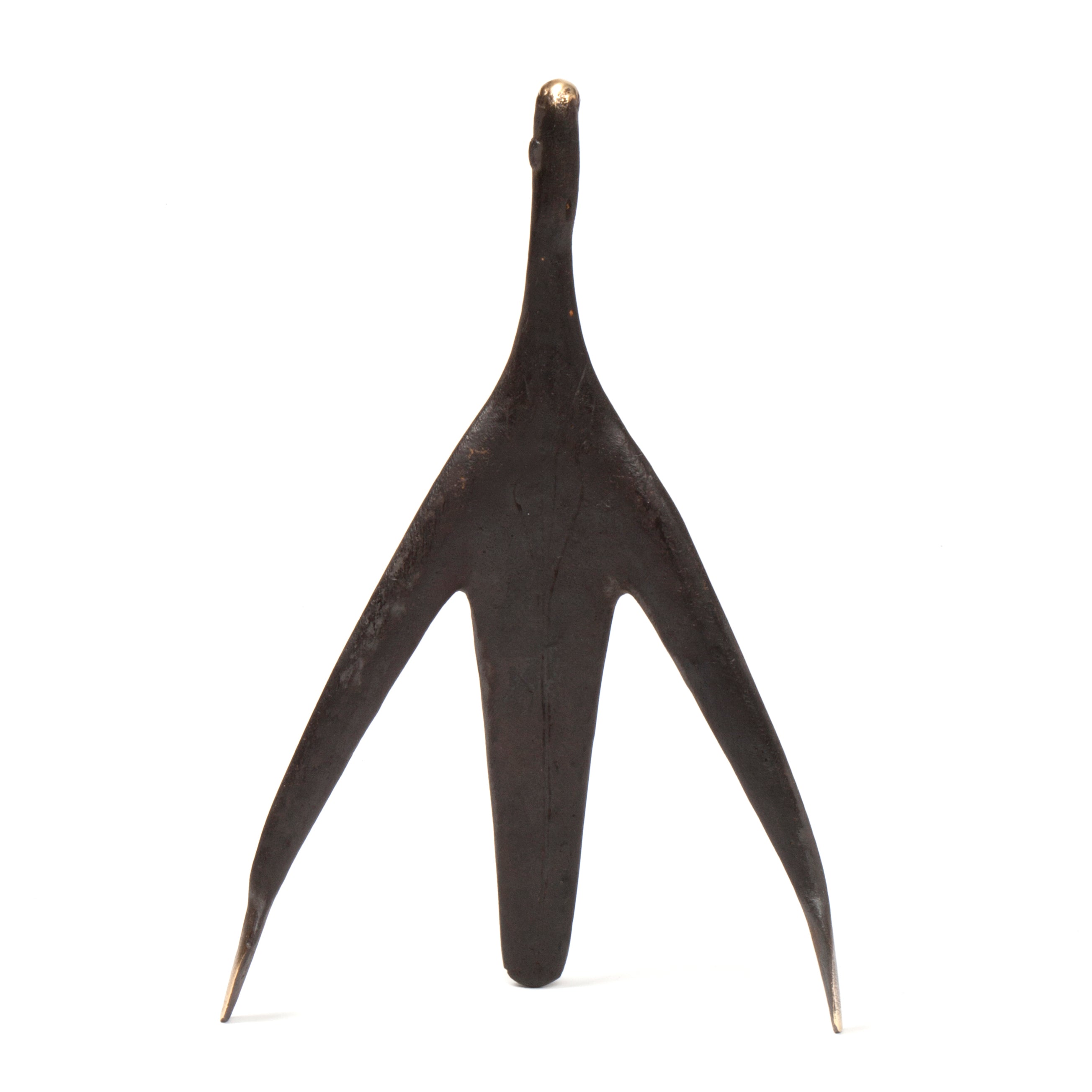 The Sculpture Architect #4061, a three-pronged dark metal object with sharp ends from Werkstätte Carl Auböck, stands upright against a plain white background.