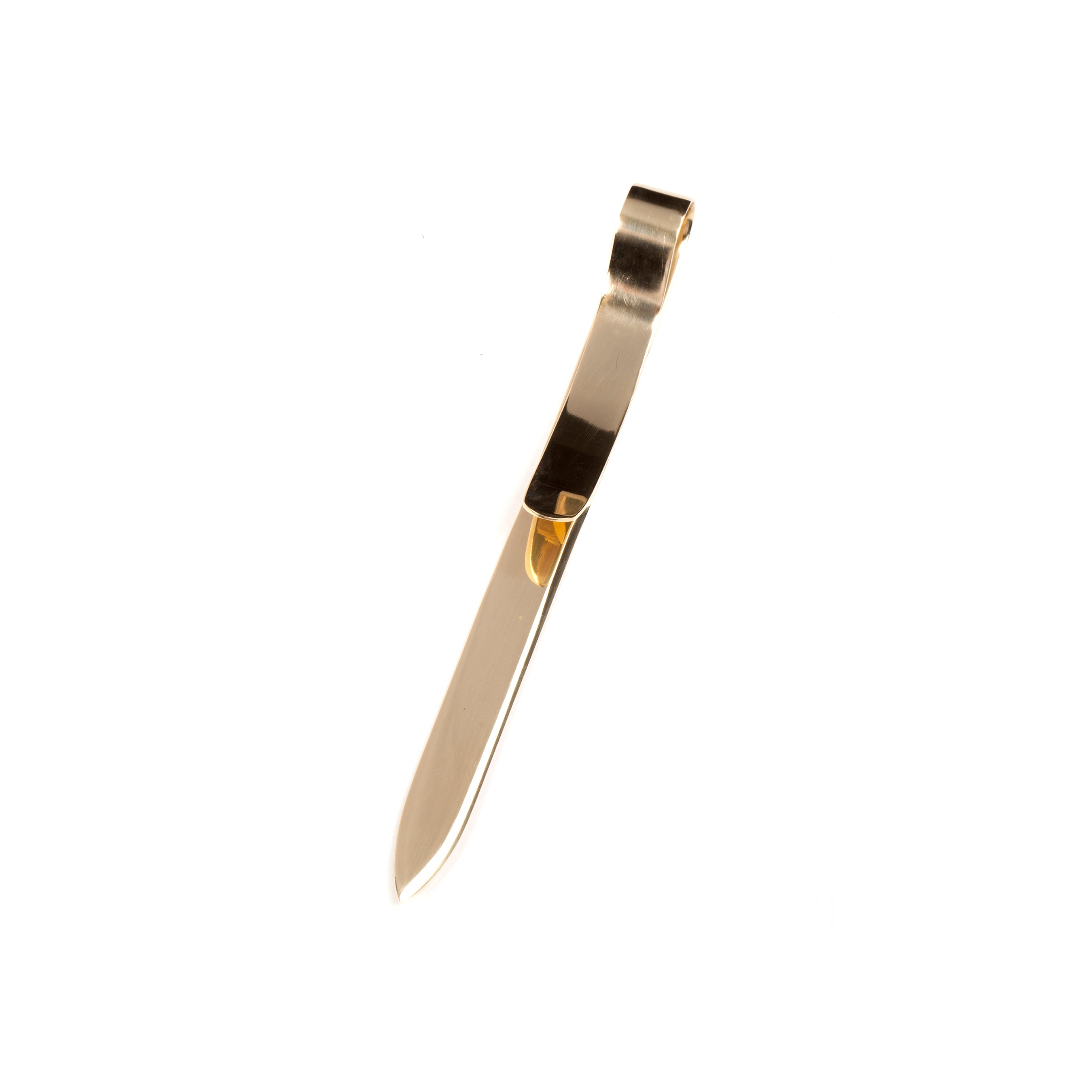 The Letter Opener #7209 by Werkstätte Carl Auböck is a sleek design with a gold or brass color, smooth polished surface, and a flat curved handle. Its straight blade ends in a pointed tip and is elegantly set against a plain white background.
