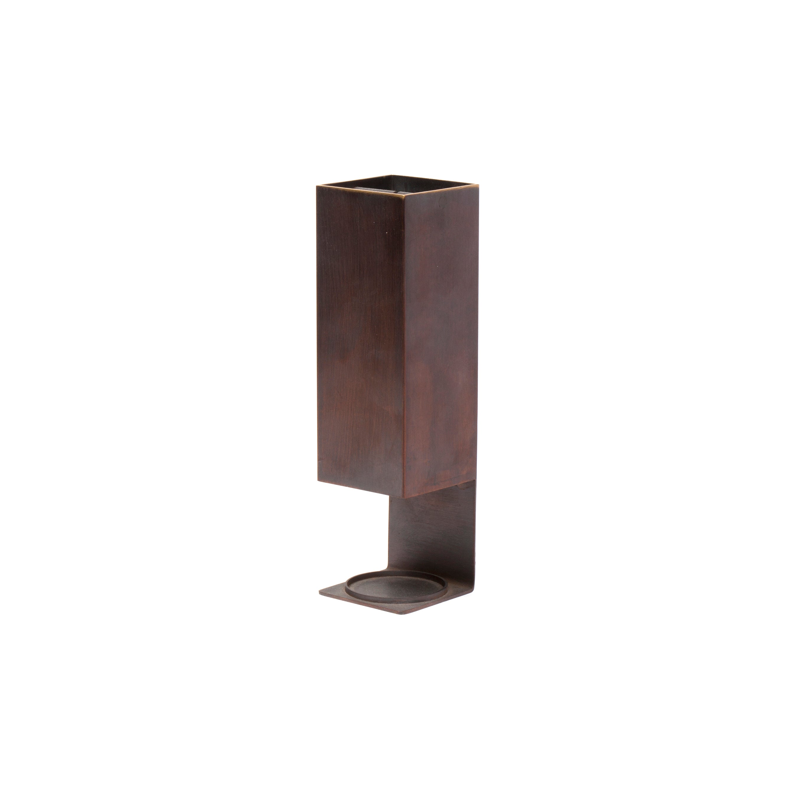 The Aroma Burner #7241 by Werkstätte Carl Auböck is a tall, rectangular, rust-brown metal piece with a minimalist design and a curved base for stability, echoing modern elegance—perfect for any office desk or workspace.