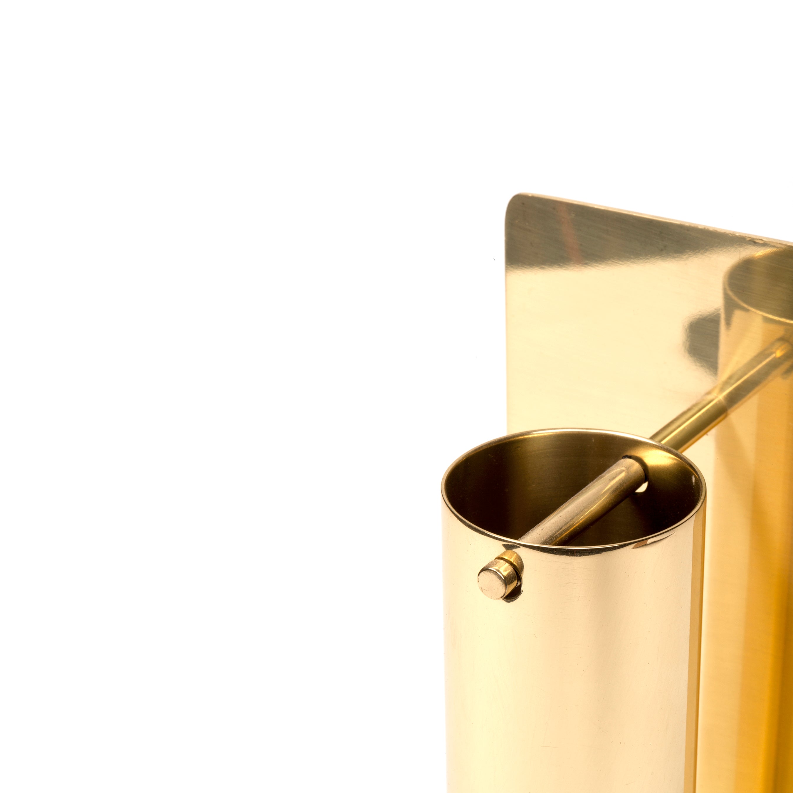 Close-up of the Aroma Burner #7242 by Werkstätte Carl Auböck, featuring a shiny, cylindrical golden design with a square backplate. Its sleek modernity evokes the elegance of a Viennese townhouse against a plain white background.