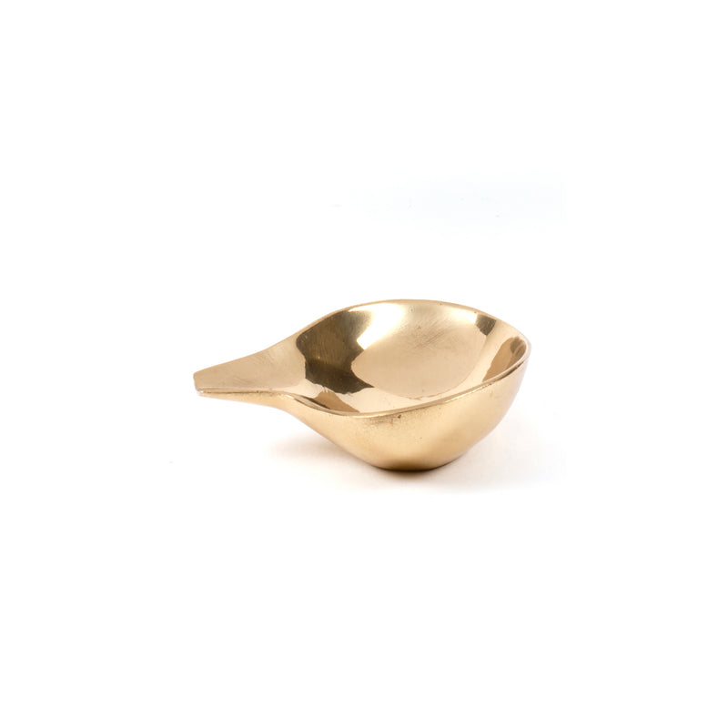 The Werkstätte Carl Auböck Dish #4206B is a gold-colored, modern metal bowl with a small handle and a smooth, shiny surface reminiscent of Wiener Bronzen. Its sleek design evokes the refined elegance of a Viennese townhouse, set against a plain white background.