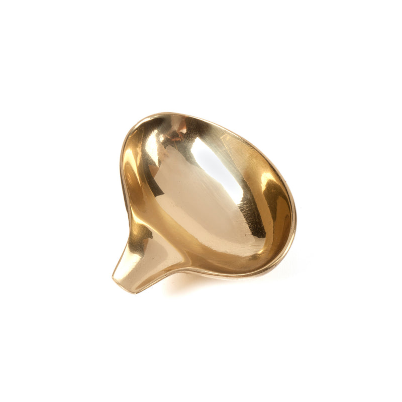 A shiny, golden ladle named Dish #4206B from Werkstätte Carl Auböck features a sleek, curved design and rests elegantly on a plain white background.