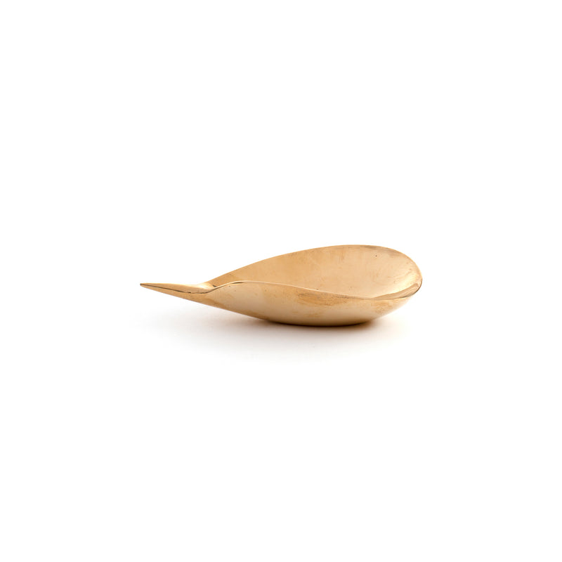 Against a plain white background, the small Dish #4206A by Werkstätte Carl Auböck boasts a smoothly carved wooden spoon with a natural finish, its curved shape and slightly pointed handle echoing the refined allure of polished brass designs.