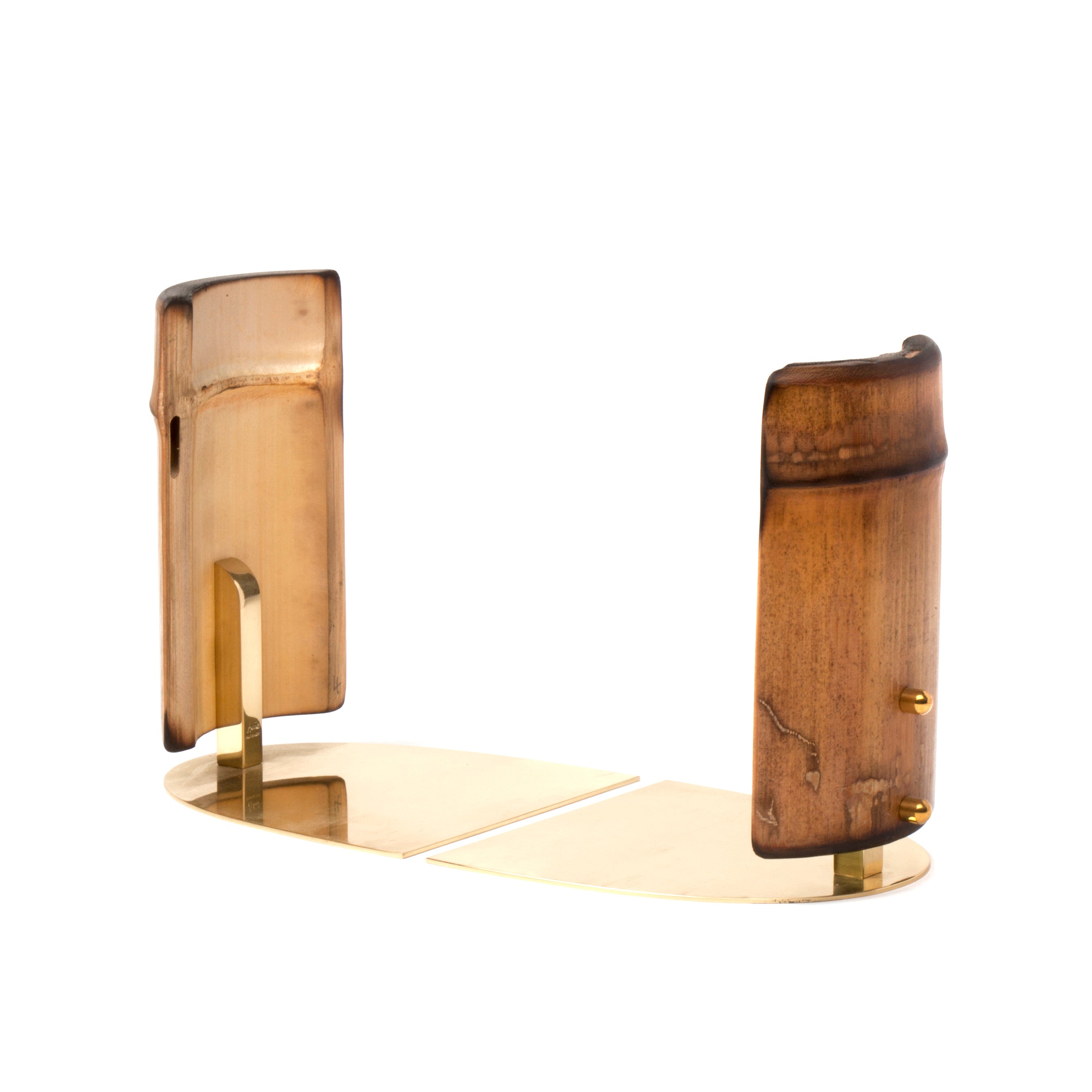 The Pair of Bookends #1937 by Werkstätte Carl Auböck features a modern, minimalist design. Each brown and gold bookend has a curved wooden panel with glossy finish and natural grain patterns, attached to a flat gold metal base, evoking the style of a Viennese townhouse.