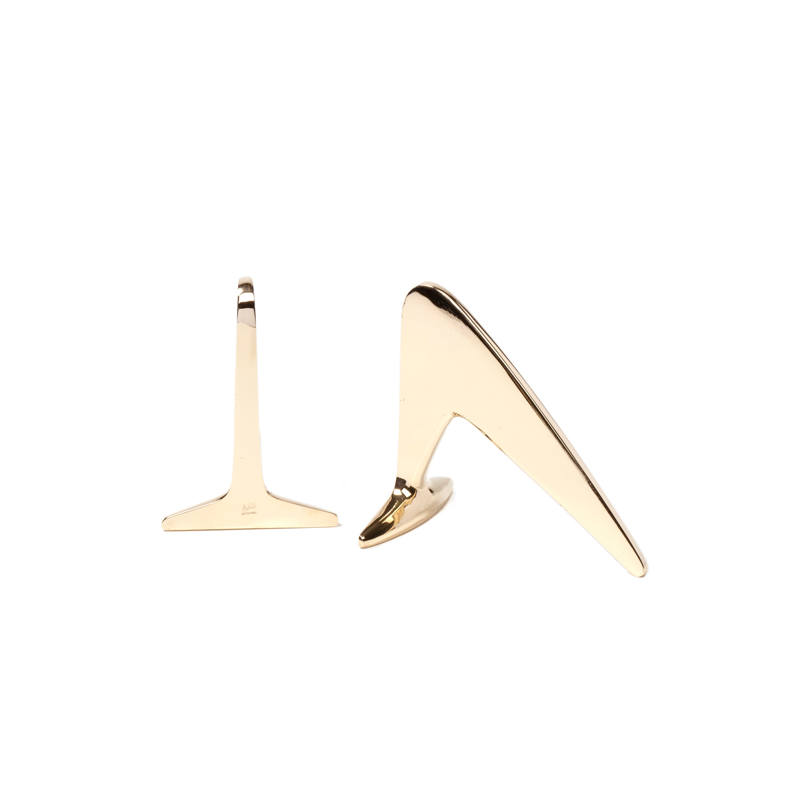 Two bookends with sleek, modern designs from Werkstätte Carl Auböcks collection #4630 are shown—a gold-colored one is upright displaying its side profile, the other is flat on a plain white background, both minimalist in style reminiscent of Carl Auböcks Viennese workshop.
