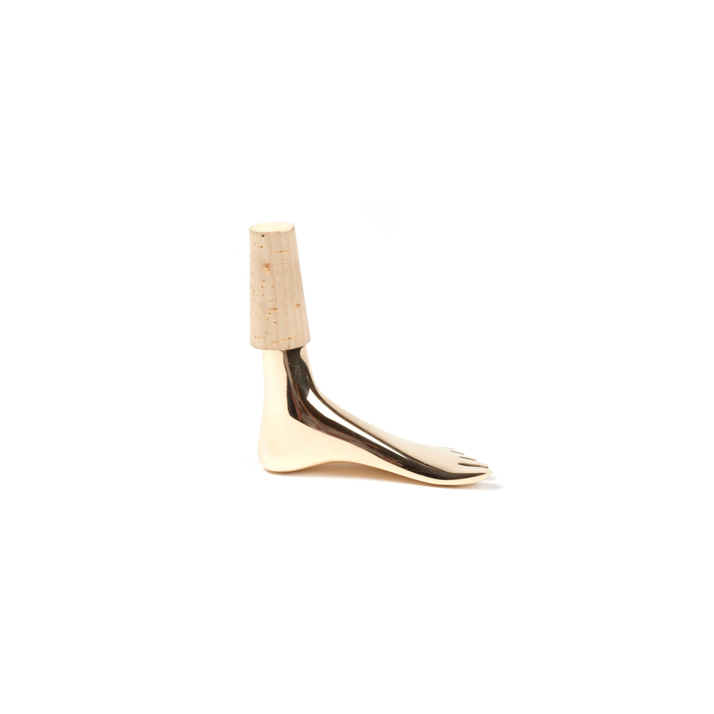 The Corkstopper Foot #4274 by Werkstätte Carl Auböck is a stylish metallic foot design with detailed heel and toes, topped with a wooden cylinder resembling a calf. The smooth finish and wood grain evoke the classic charm of Wiener Bronzen against a plain white background.