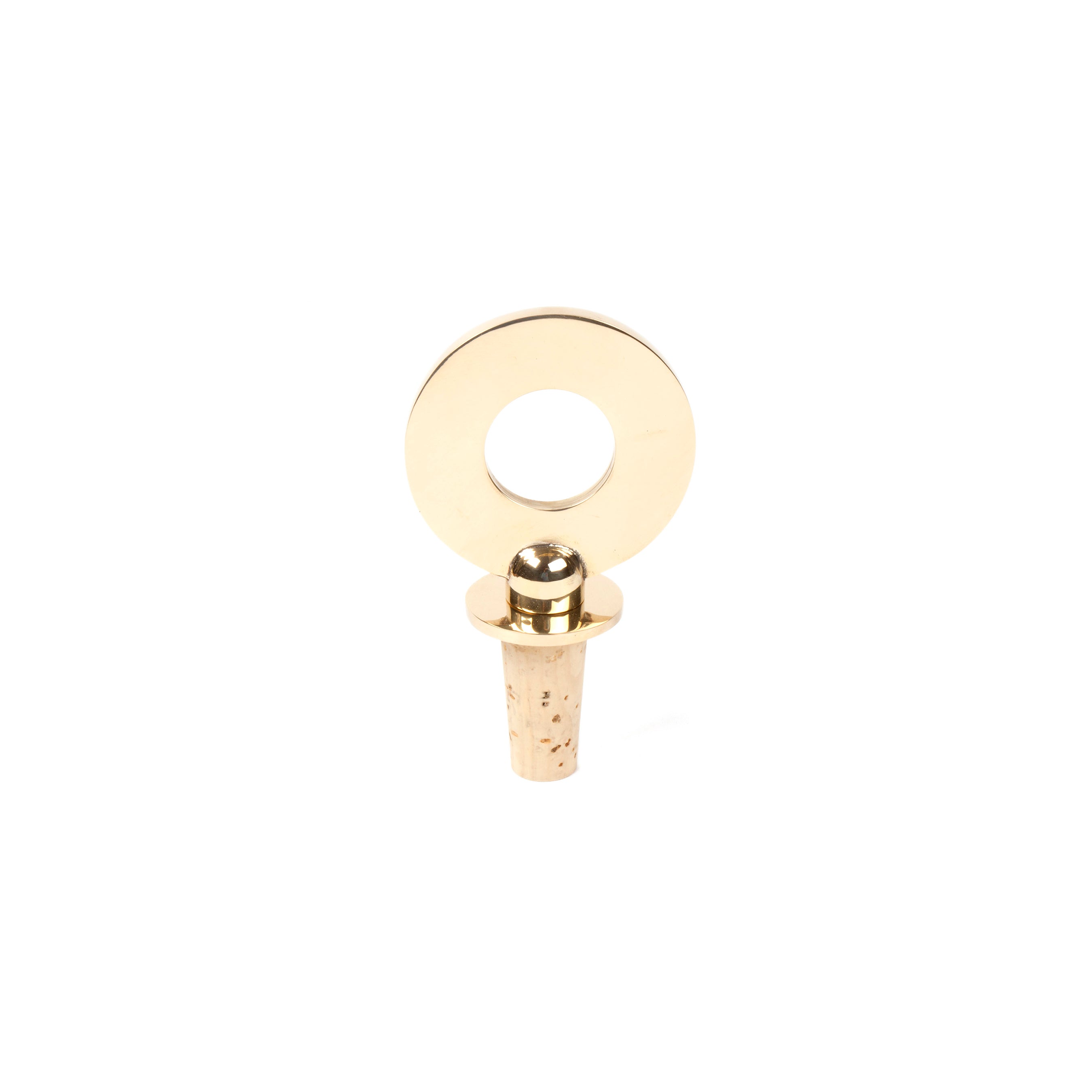 The Werkstätte Carl Auböck Corkstopper Ring #5971 features a sleek gold circular design with a large ring and cork base, evoking the elegance of a Viennese townhouse—ideal for sealing and preserving wine.