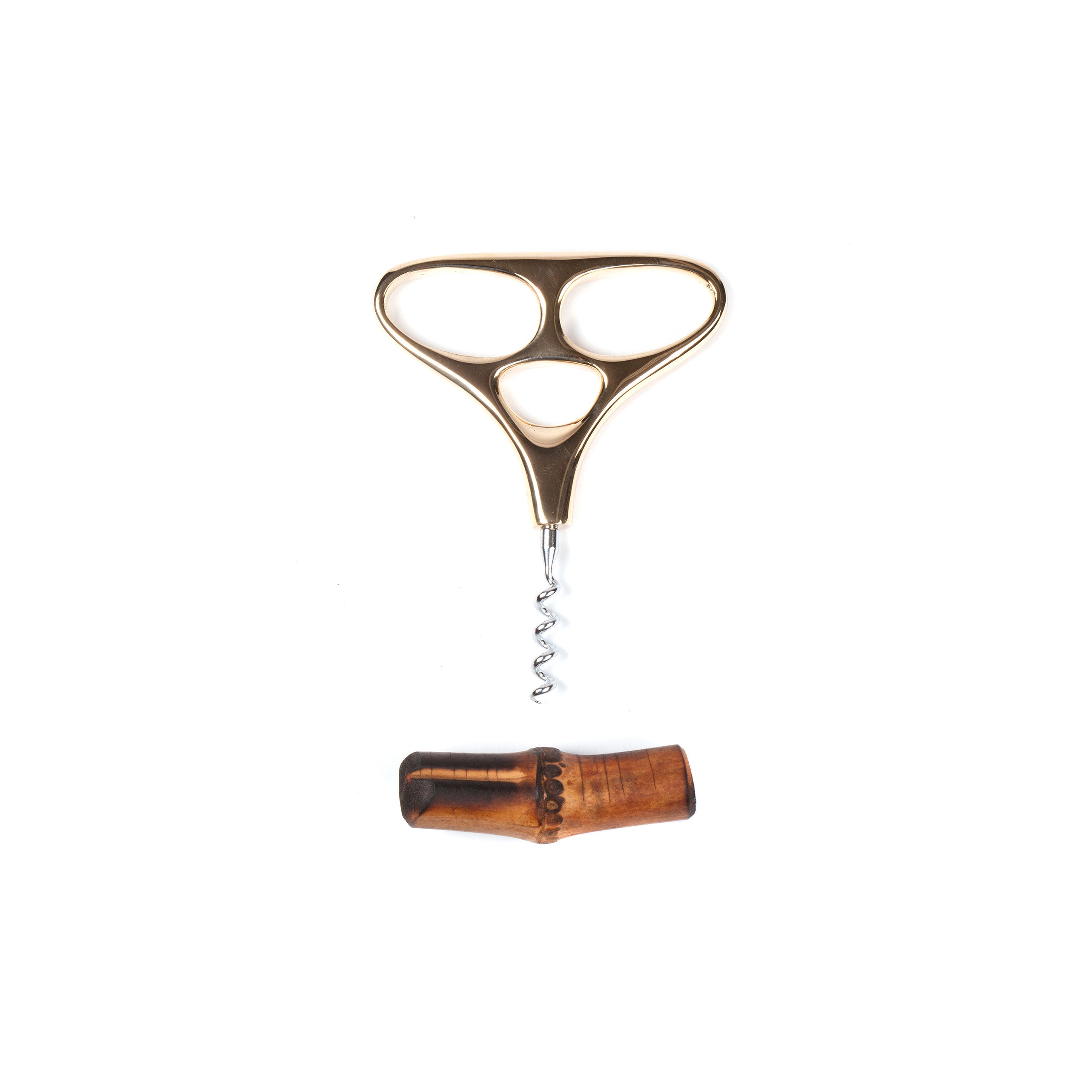 The Corkscrew Skull #4230 by Werkstätte Carl Auböck boasts a vintage design with a metallic, triangle-shaped handle featuring three holes and an adjacent wooden sheath. The spiral metal screw extends from the handle, set against a white background.