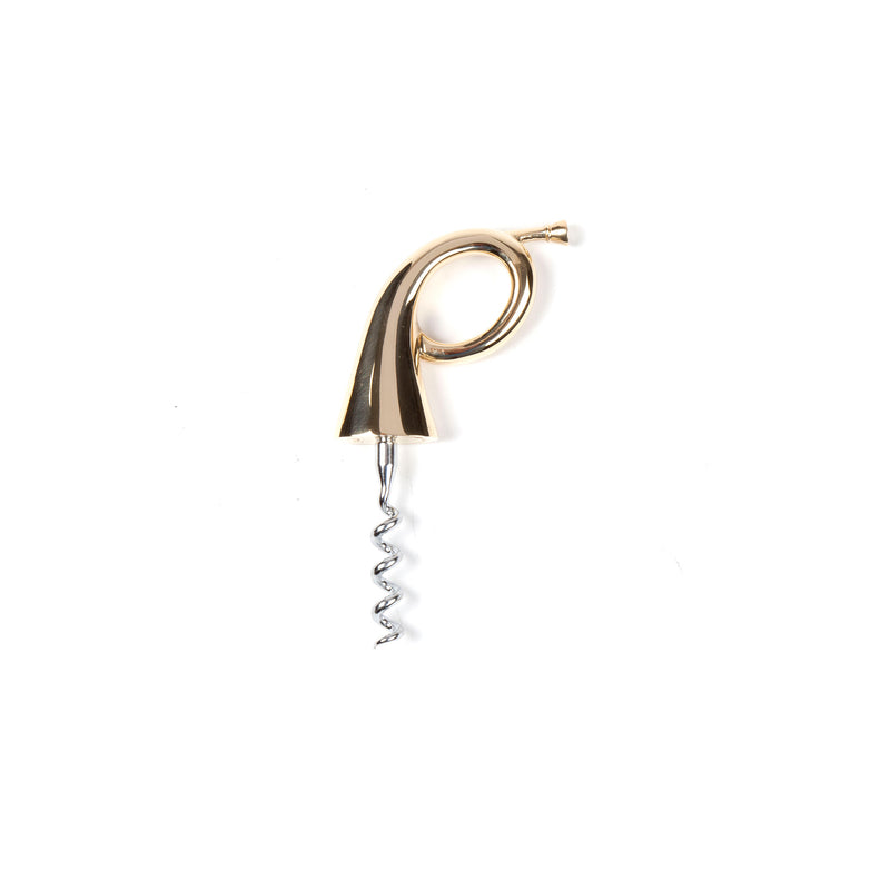 The Corkscrew Posthorn #4568 by Werkstätte Carl Auböck features a gold and silver, musical note-shaped handle reminiscent of an Auböck design. It has a coiled metal screw for opening wine bottles and stands elegantly against a plain white background.