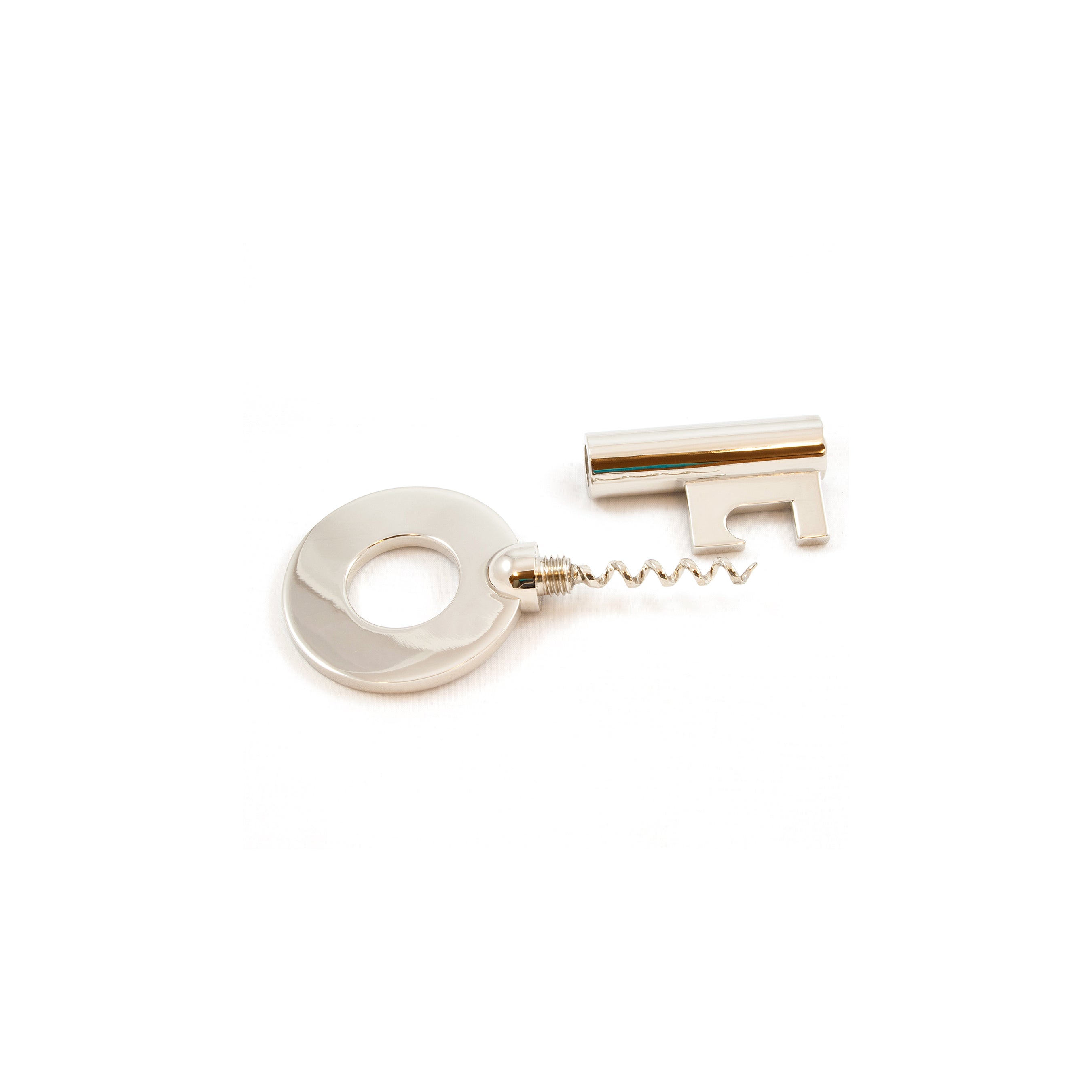 The Corkscrew Key #5970 by Werkstätte Carl Auböck, with its iconic silver-colored key design, is highlighted against a white background. It has a round handle, an elegant spiral corkscrew, and a cylindrical casing, skillfully resembling the shape of a key.