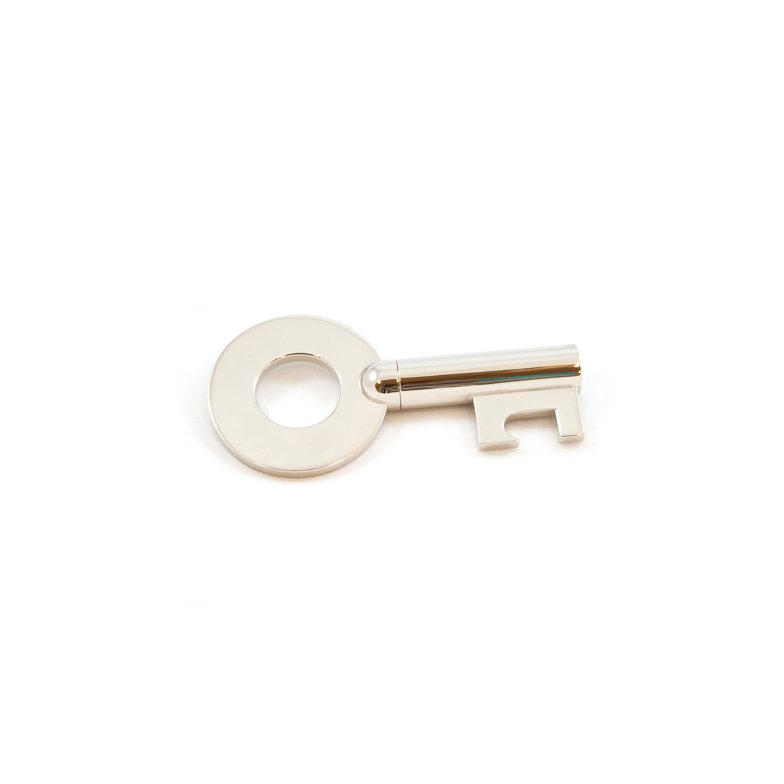The Corkscrew Key #5970 by Werkstätte Carl Auböck features a silver-colored metal key with a round handle and minimalist design, set against a plain white background.
