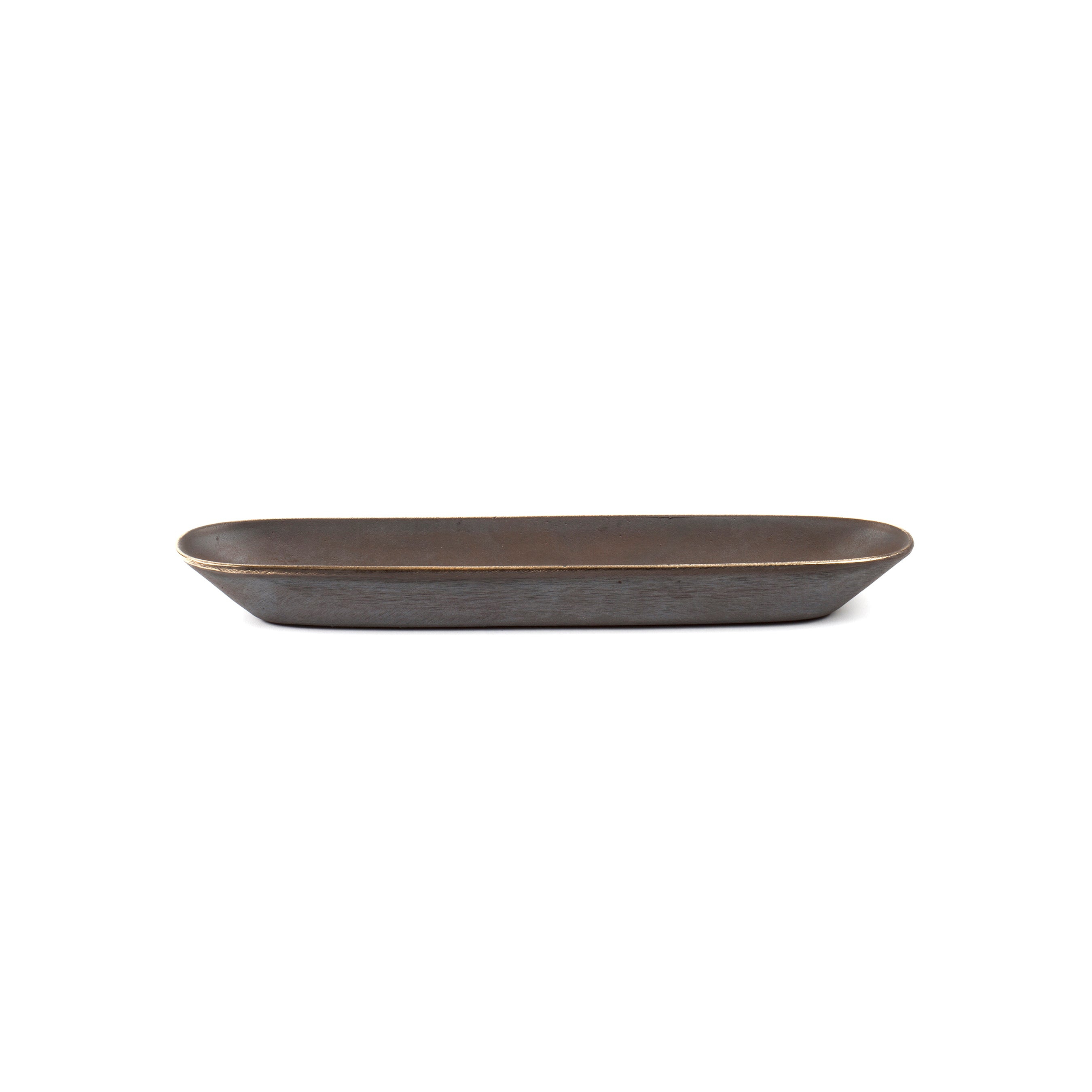 Dish #4317 by Werkstätte Carl Auböck is a rectangular, dark brown ceramic dish with slightly curved edges and a matte finish, echoing the artistry of a Viennese workshop. It sits empty against a plain white background.
