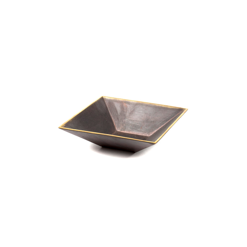 A square, dark, shallow bowl with a subtle metallic sheen and golden trim, reminiscent of an Auböck design, set against a plain white background is Werkstätte Carl Auböcks Dish #4482.