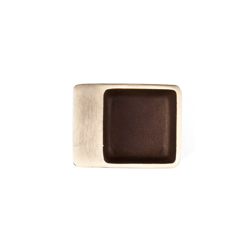 Ashtray #4610 by Werkstätte Carl Auböck features a brushed rectangular metal body with a recessed dark brown square center, seen from above on a white background.
