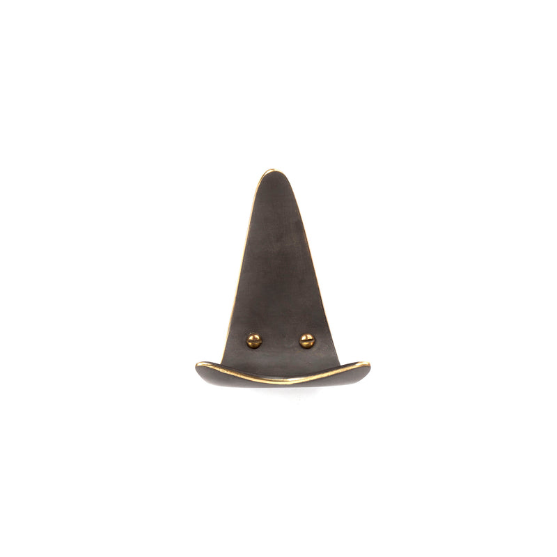A whimsical minimalist face-shaped hook with a pointy hat, crafted from metal and designed by Werkstätte Carl Auböck. Featuring rivet eyes and a curved base smile, its part of the Set of 3 Hooks #4086, charmingly displayed on a plain white background.