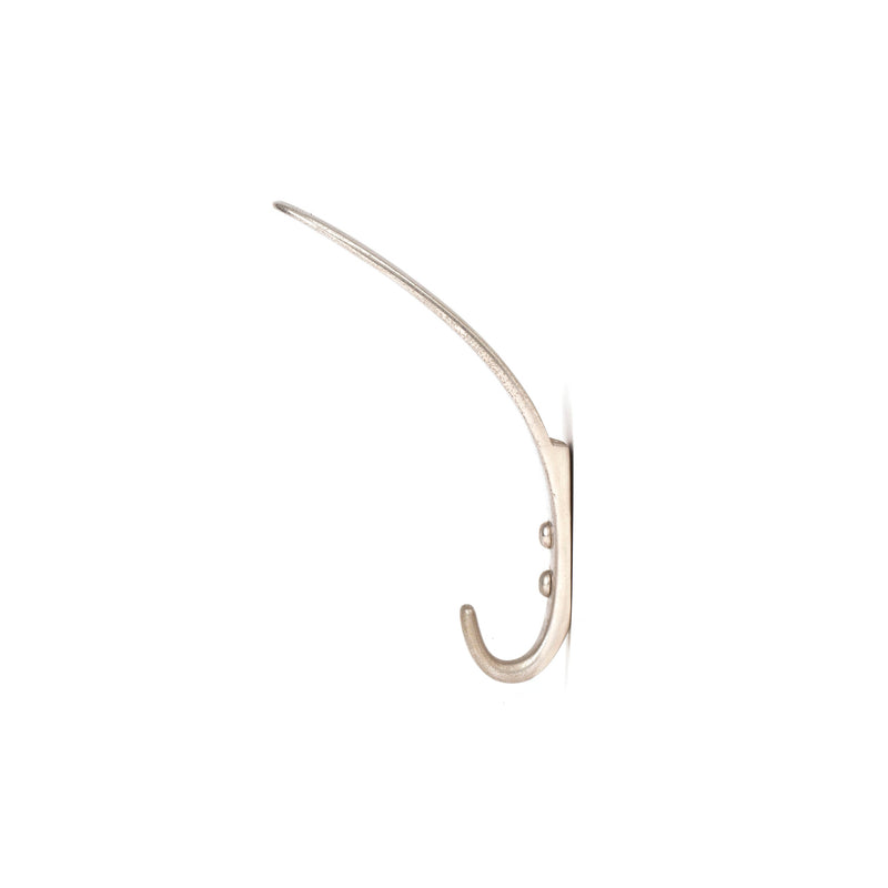 The Set of 3 Hooks #4327 from Werkstätte Carl Auböck features a sleek, metallic design reminiscent of a Viennese townhouses elegance, with gently curved brass cast hooks against a white background. Expertly angled upward, theyre perfect for hanging items.