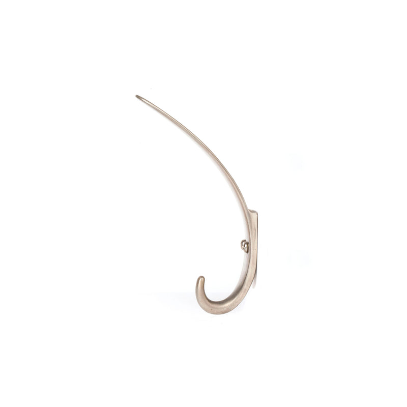The Set of 3 Hooks #4329 by Werkstätte Carl Auböck features a sleek brass design mounted on white. Reminiscent of Viennese workshop creations, the hooks curve upward with a smooth finish, perfect for hanging items.