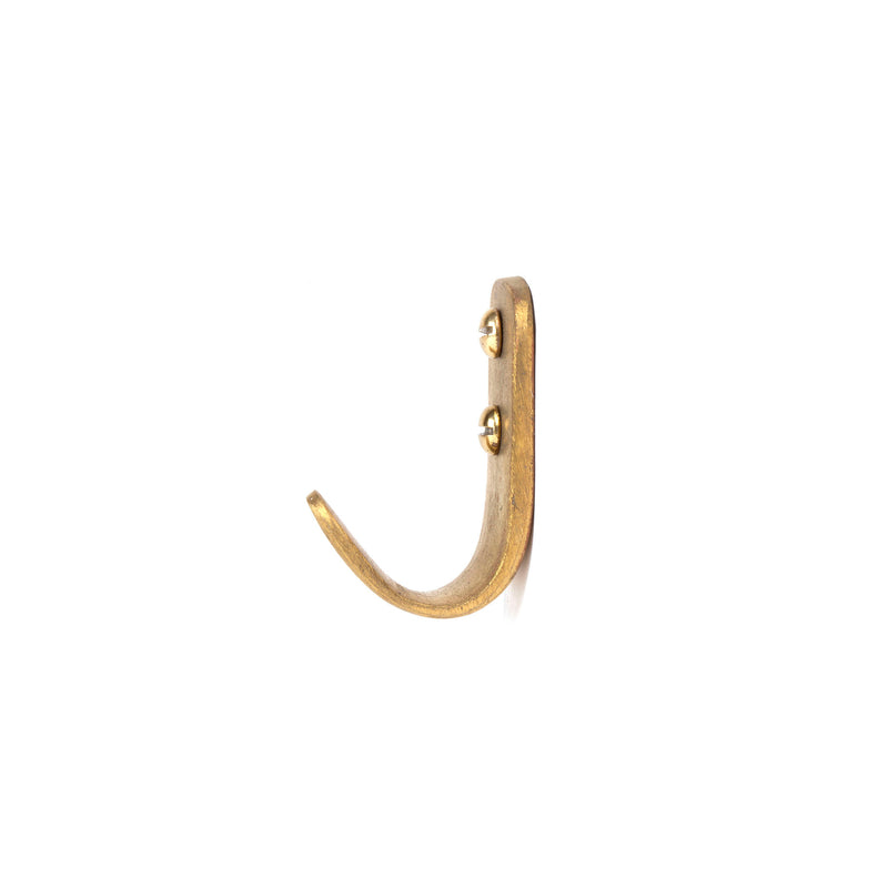 The Set of 3 Hooks #4330 by Werkstätte Carl Auböck features a simple, curved brass design reminiscent of Viennese craftsmanship. Mounted on white with two visible screws, the hook curves upwards, ideal for hanging lightweight items.