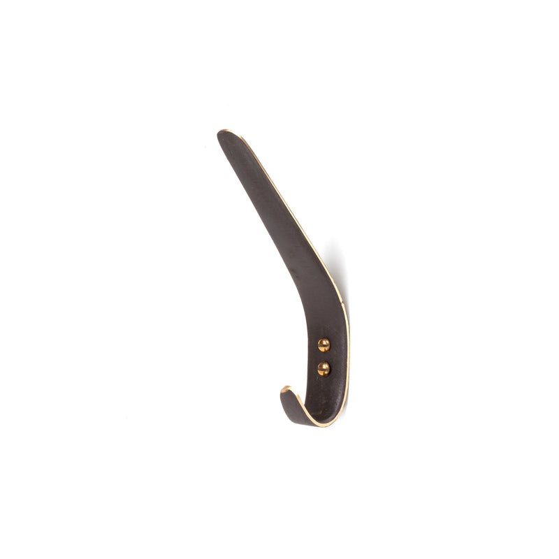 The Werkstätte Carl Auböck Set of 3 Hooks #4330 features a sleek, metallic design with a dark finish. Reminiscent of Viennese craftsmanship, these hooks include two visible screws and a simple curve that stands out against any white background.