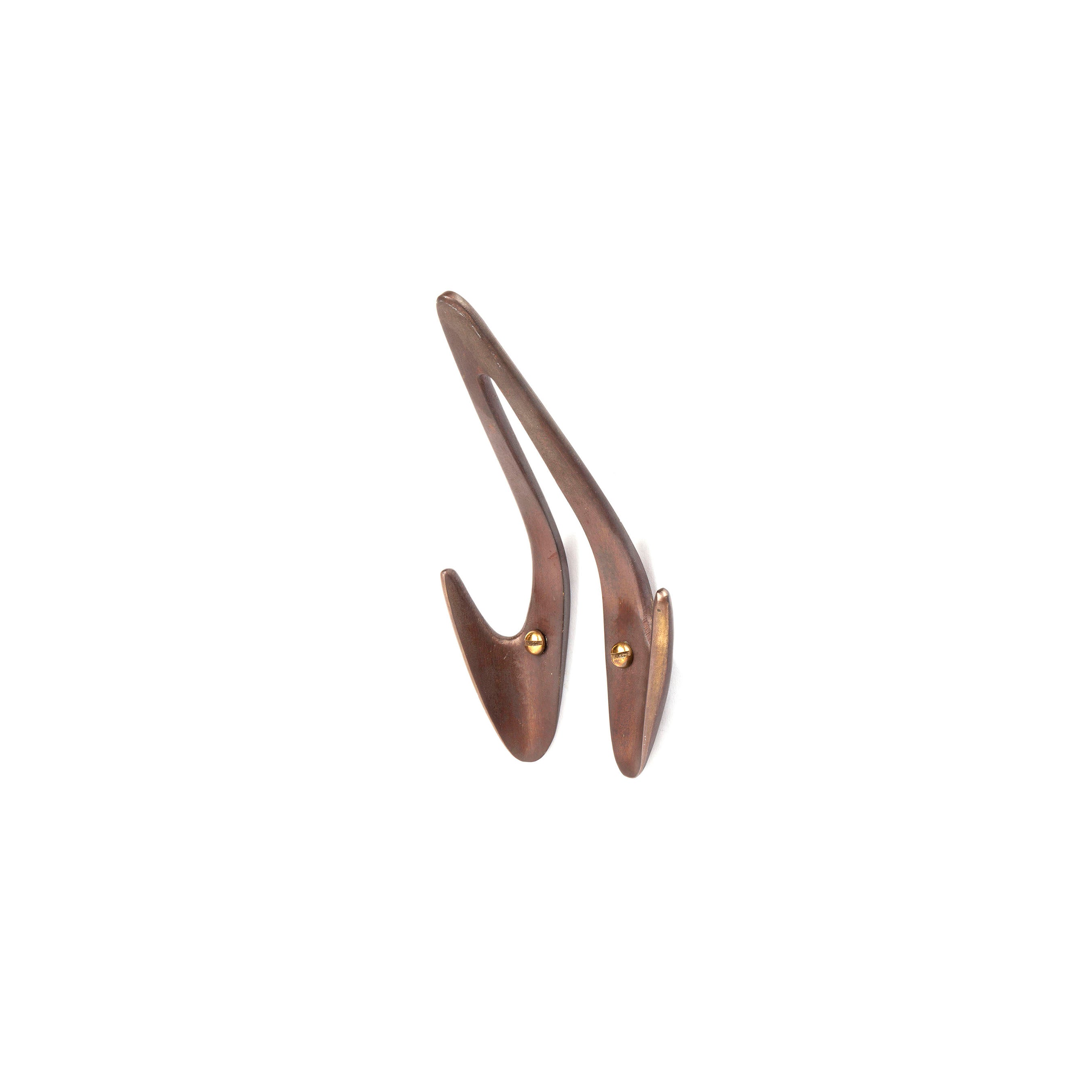 The Set of 3 Hooks #4994 by Werkstätte Carl Auböck features a sleek, curved walnut design with a warm brown wood grain and brass-colored accents. It reflects the elegance of a Viennese townhouse against a simple white background.