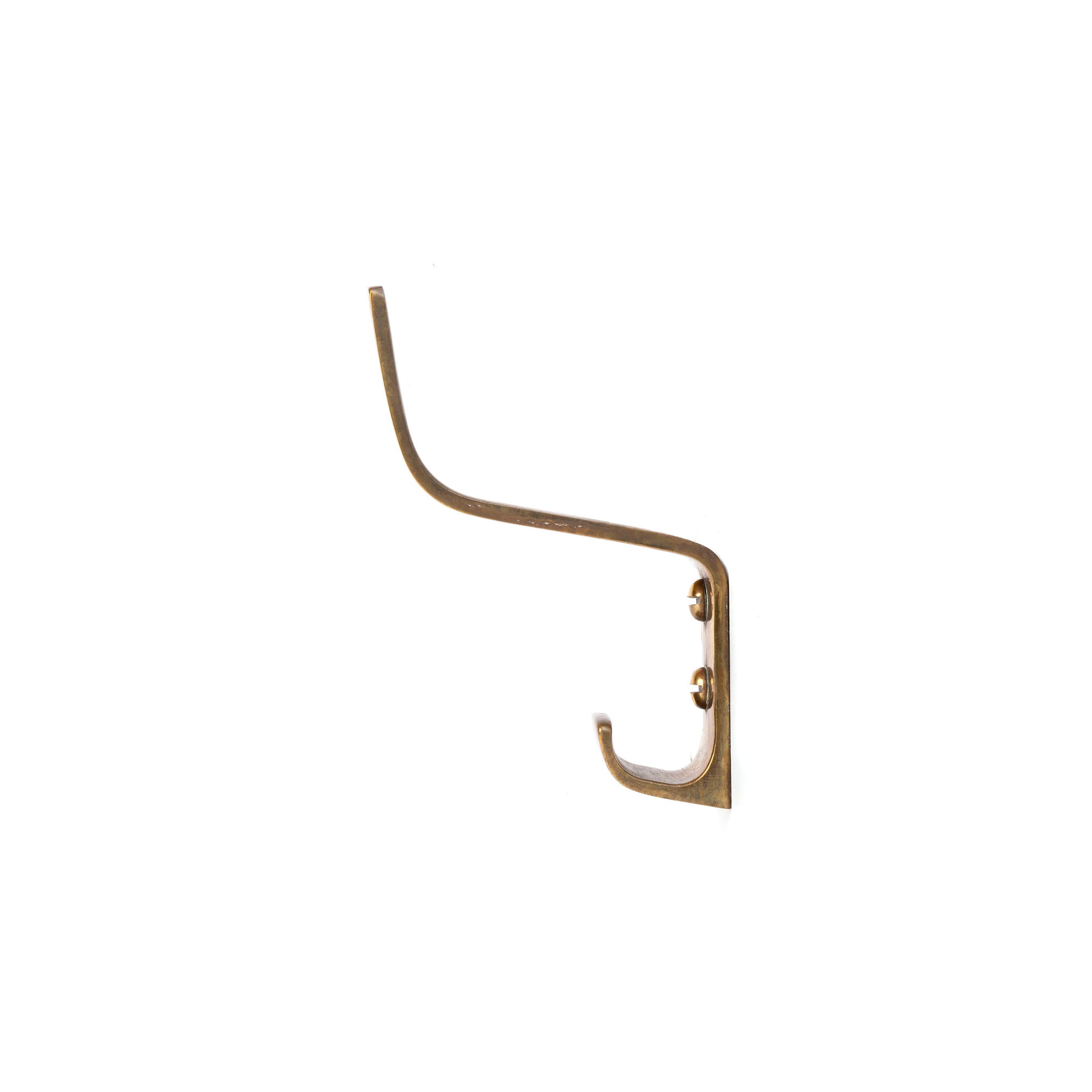 The Werkstätte Carl Auböck Set of 3 Hooks #5261 features minimalist, brass-colored metal hooks with two prongs. Mounted on a white background with two screws, they offer an elegantly simple design with a subtle curve.