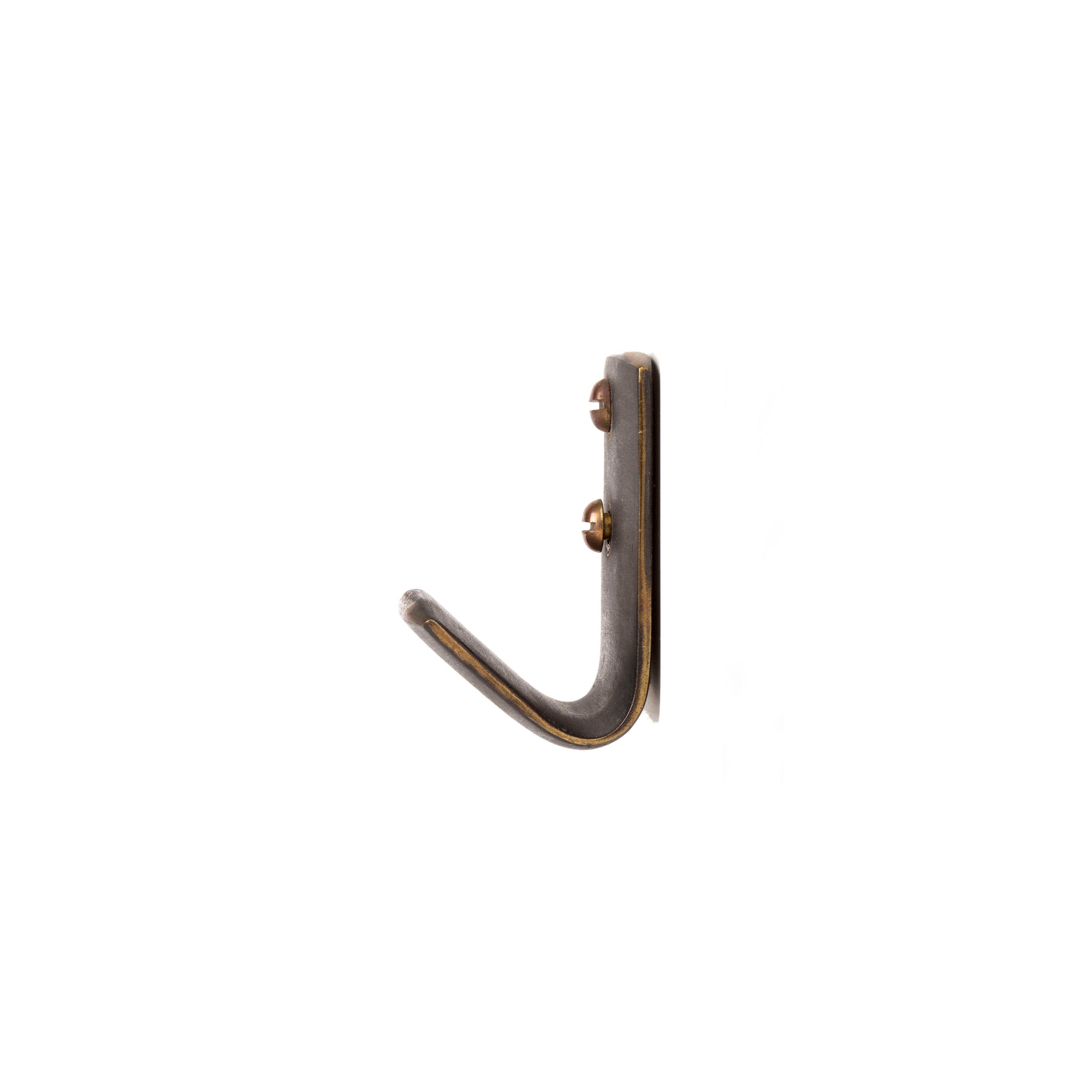 A single hook from the Set of 3 Hooks #5262 by Werkstätte Carl Auböck, featuring a curved metal design reminiscent of their craftsmanship, is attached to a white background with two visible screws.