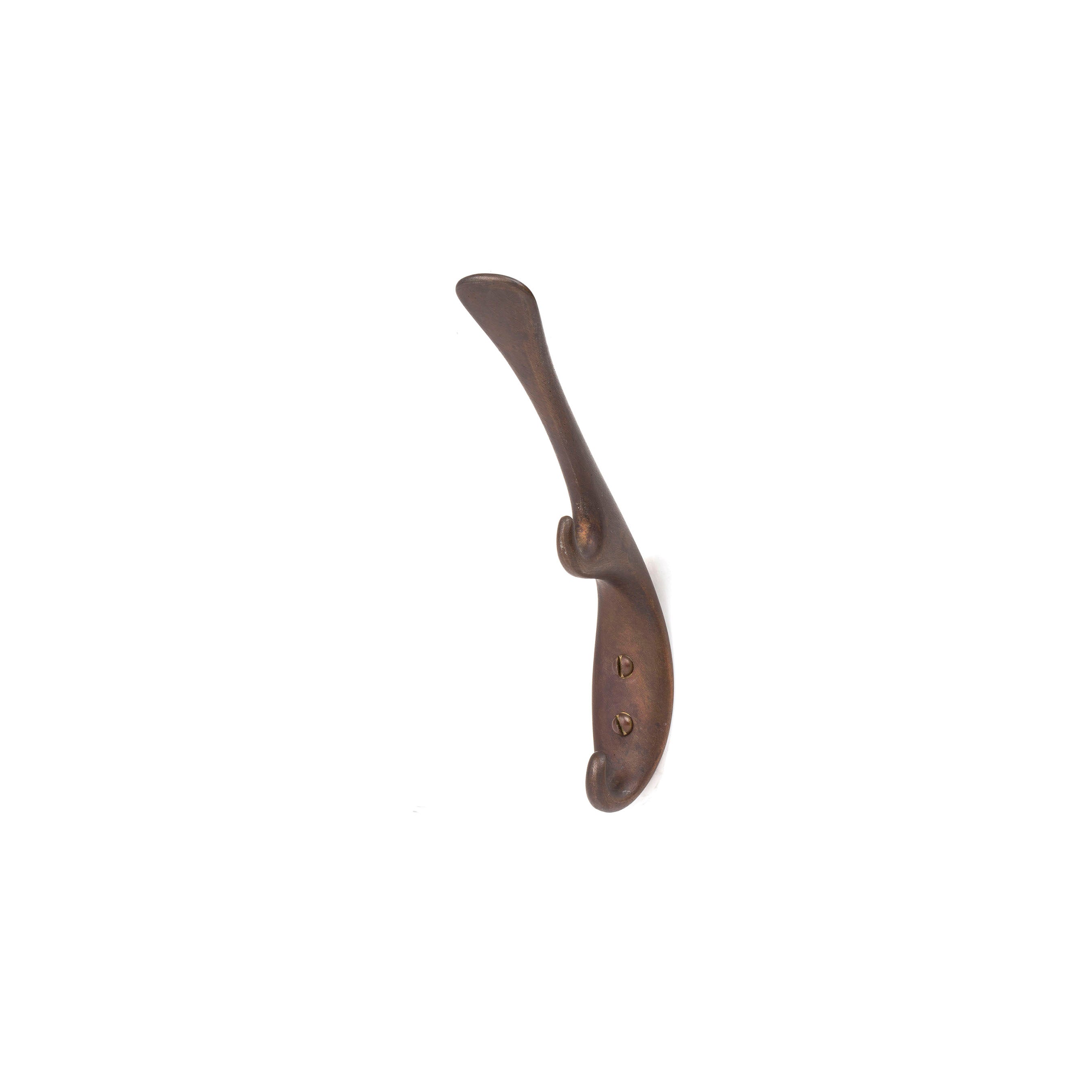 A single bronze coat hook from Werkstätte Carl Auböck’s Set of 3 Hooks #5439, with a curved shape reminiscent of the Wiener Bronzen style and featuring two mounting holes, is shown against a plain white background.
