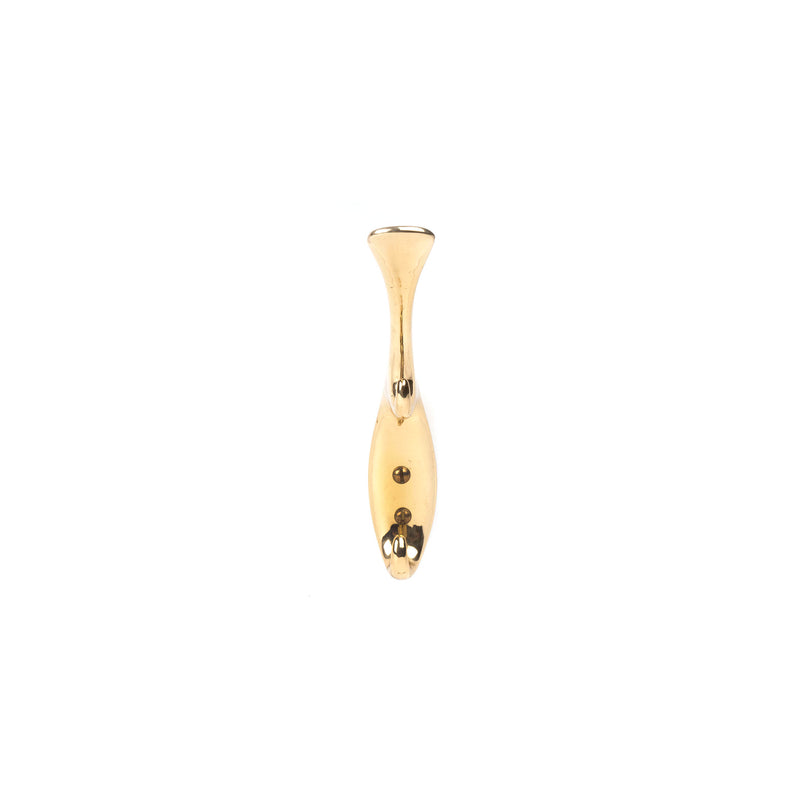 A small, elongated, gold-colored metal object with a bulbous top and two holes at the base stands upright against a white background, echoing the refined elegance of a Werkstätte Carl Auböck design. It is part of the Set of 3 Hooks #5439, typically seen in classic Viennese townhouses.
