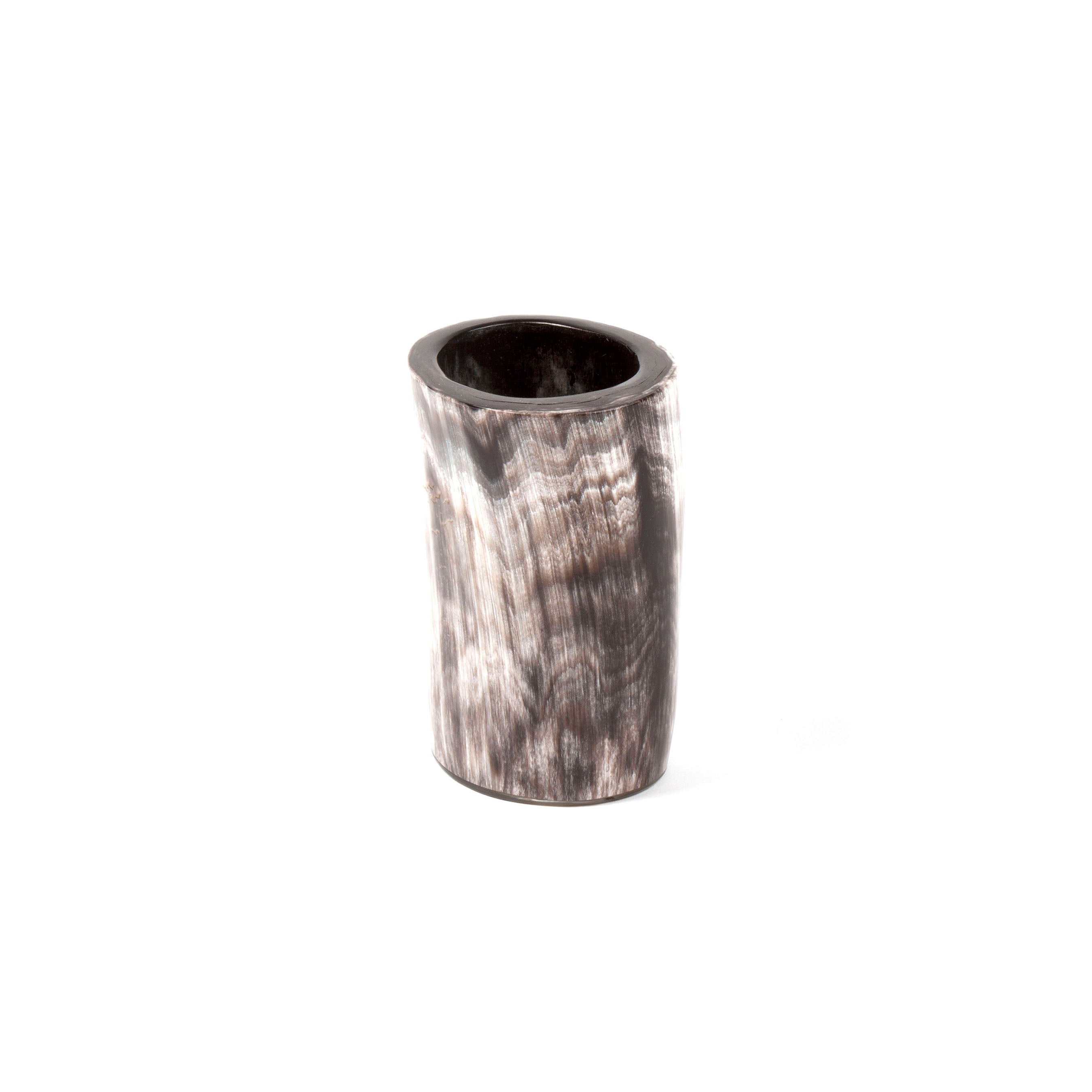 The Cup Horn #4712 by Werkstätte Carl Auböck is a cylindrical vessel with a textured, wavy black and gray pattern, mimicking marbled stone in a classic Viennese townhouse, featuring a minimalist design with a smooth, glossy finish.