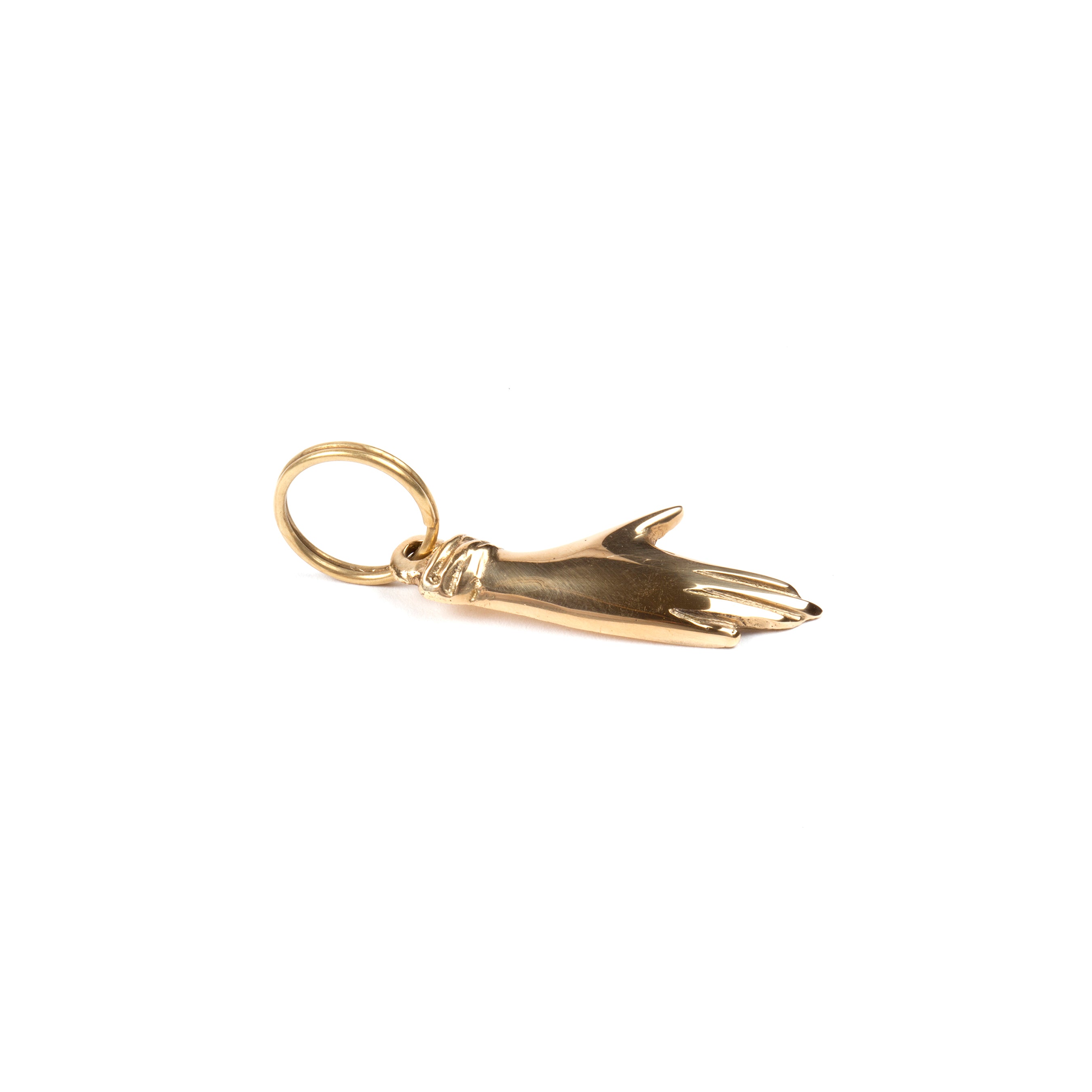 The Keyring Hand #5734 by Werkstätte Carl Auböck, inspired by a Carl Auböck brass design, features a detailed outstretched hand with fingers and cuff. Attached to a simple loop, it suits necklaces and bracelets. Its polished surface reflects light gracefully, celebrating its Viennese heritage.