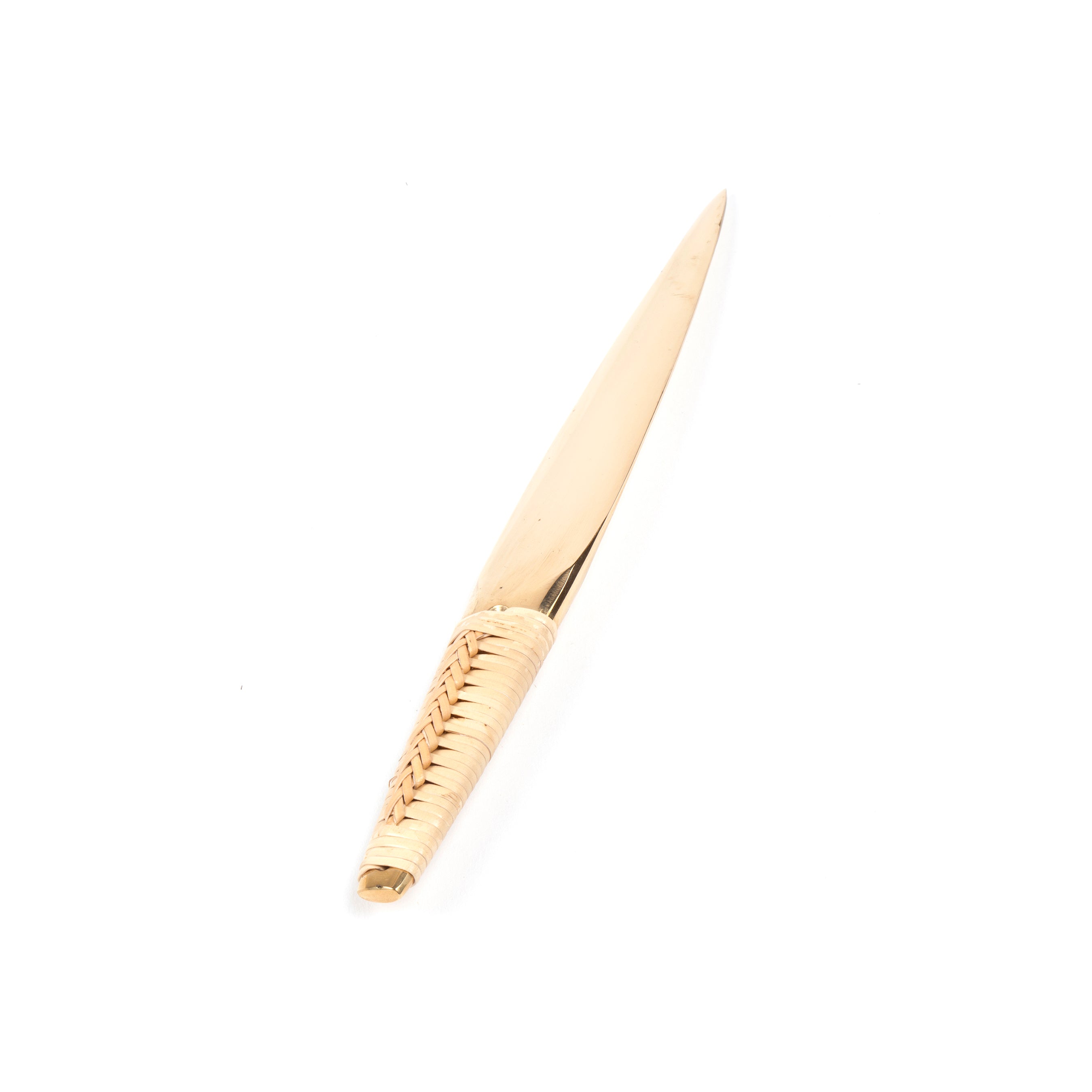 The sleek gold letter opener, Werkstätte Carl Auböcks #4233, features a pointed tip and a textured, woven-pattern handle set against a plain white background.