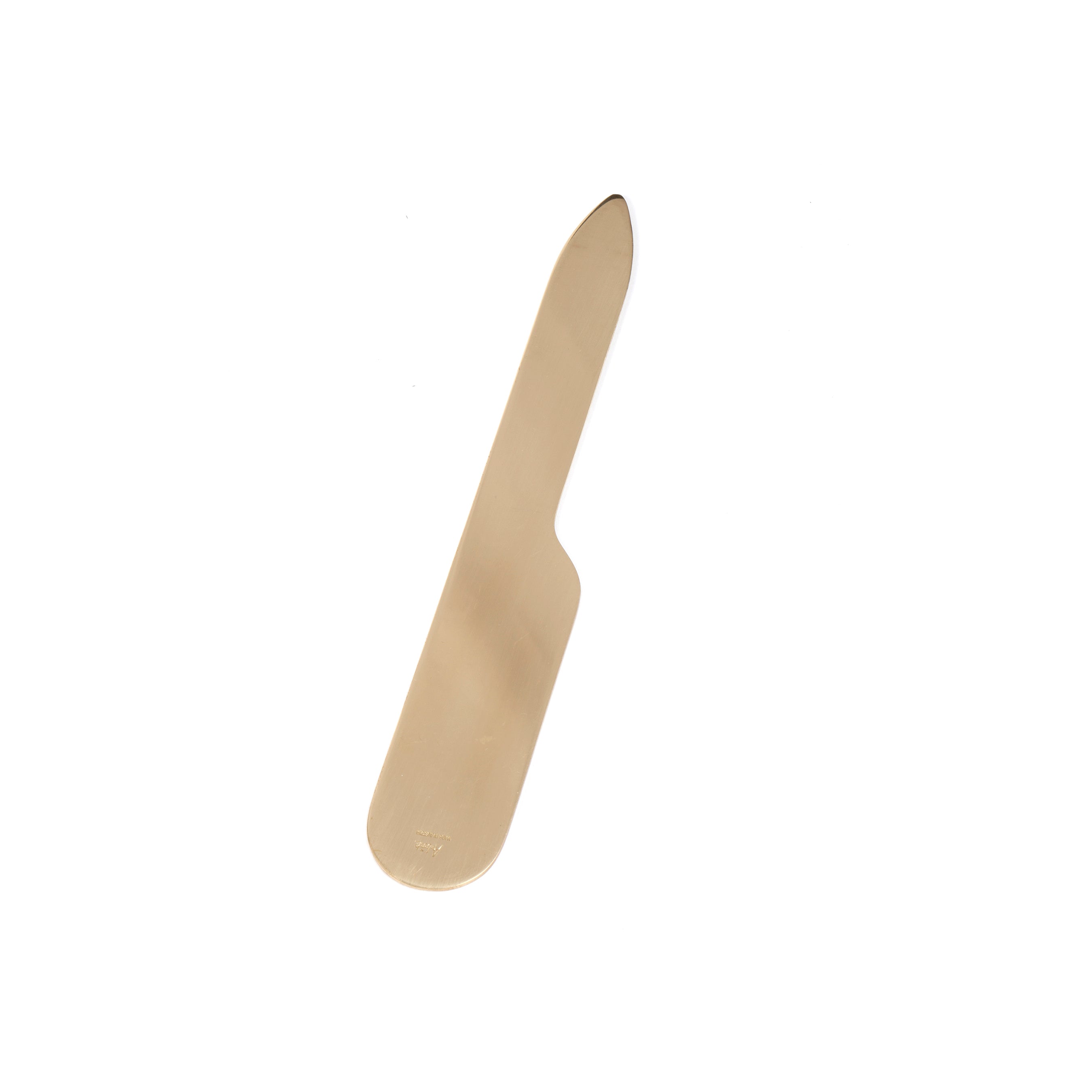 The Letter Opener #7127 by Werkstätte Carl Auböck is a sleek, modern brass tool with a minimalist design, elegantly poised on a plain white background.