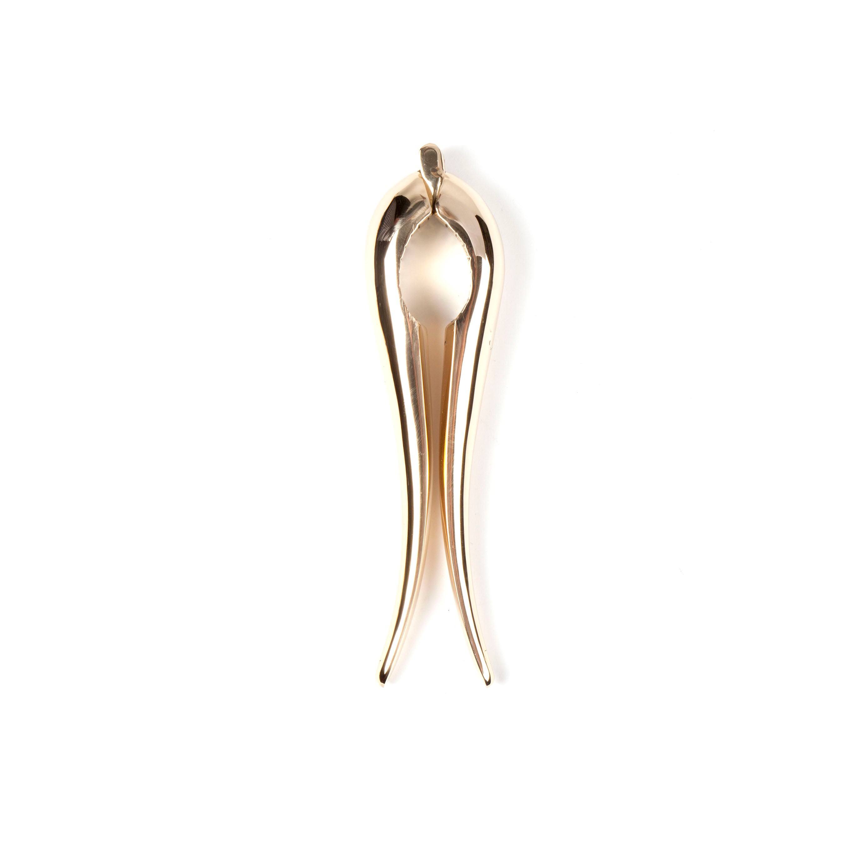 The Werkstätte Carl Auböck Nutcracker #4051 is a sleek, stylized golden squid-shaped sculpture with elongated arms set against a white background.
