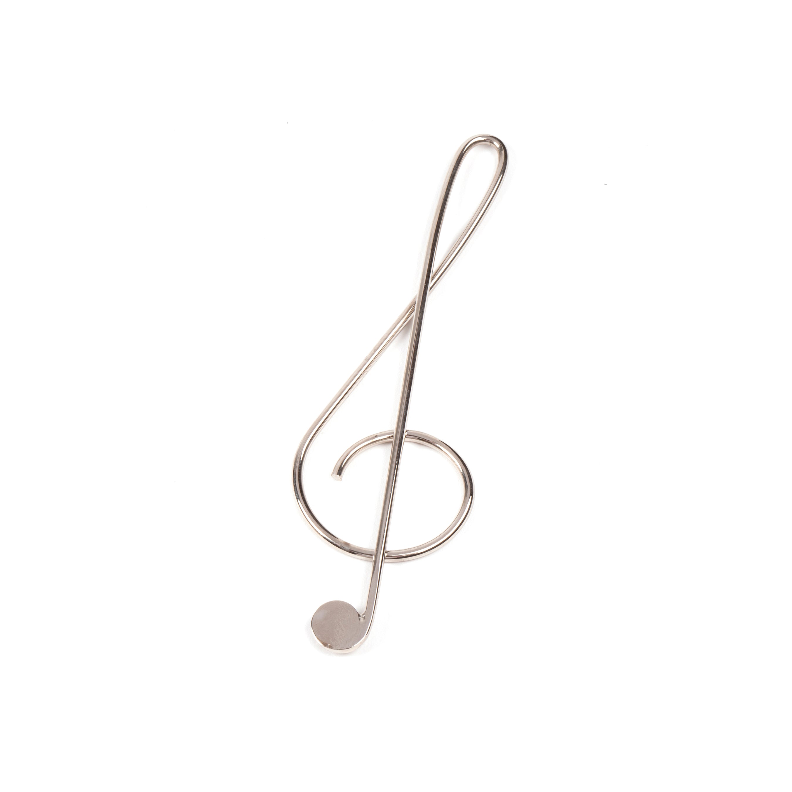 A Paper Clip Musical Clef #4740 from Werkstätte Carl Auböck, this brass paperclip emulates a treble clef, reminiscent of Carl Auböcks design aesthetic, isolated on a white background.
