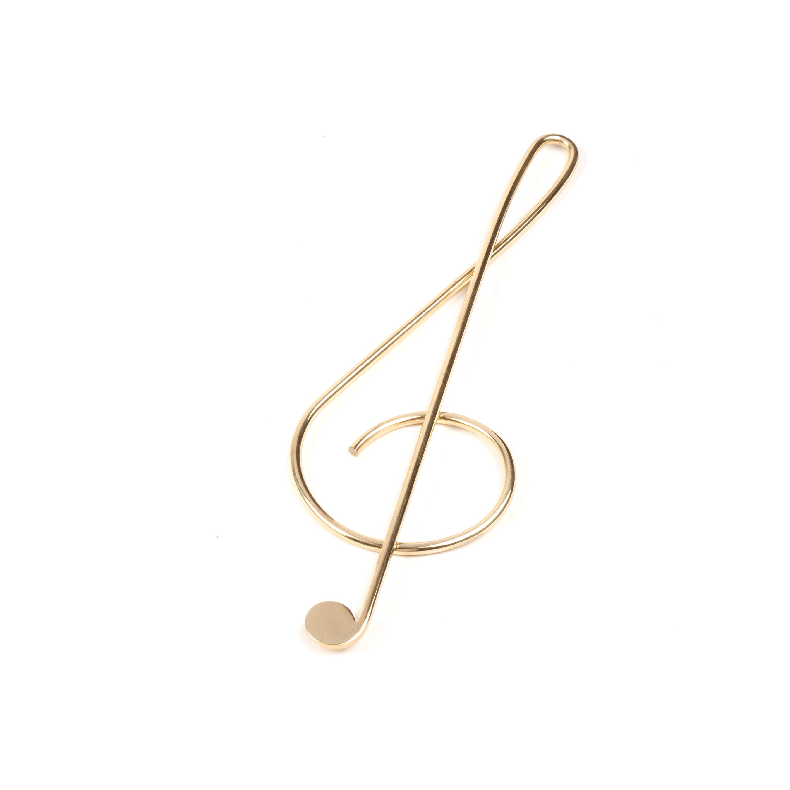 Paper Clip Musical Clef #4740 by Werkstätte Carl Auböck features an elegantly twisted brass treble clef with a circular base, capturing refined design against a white backdrop.