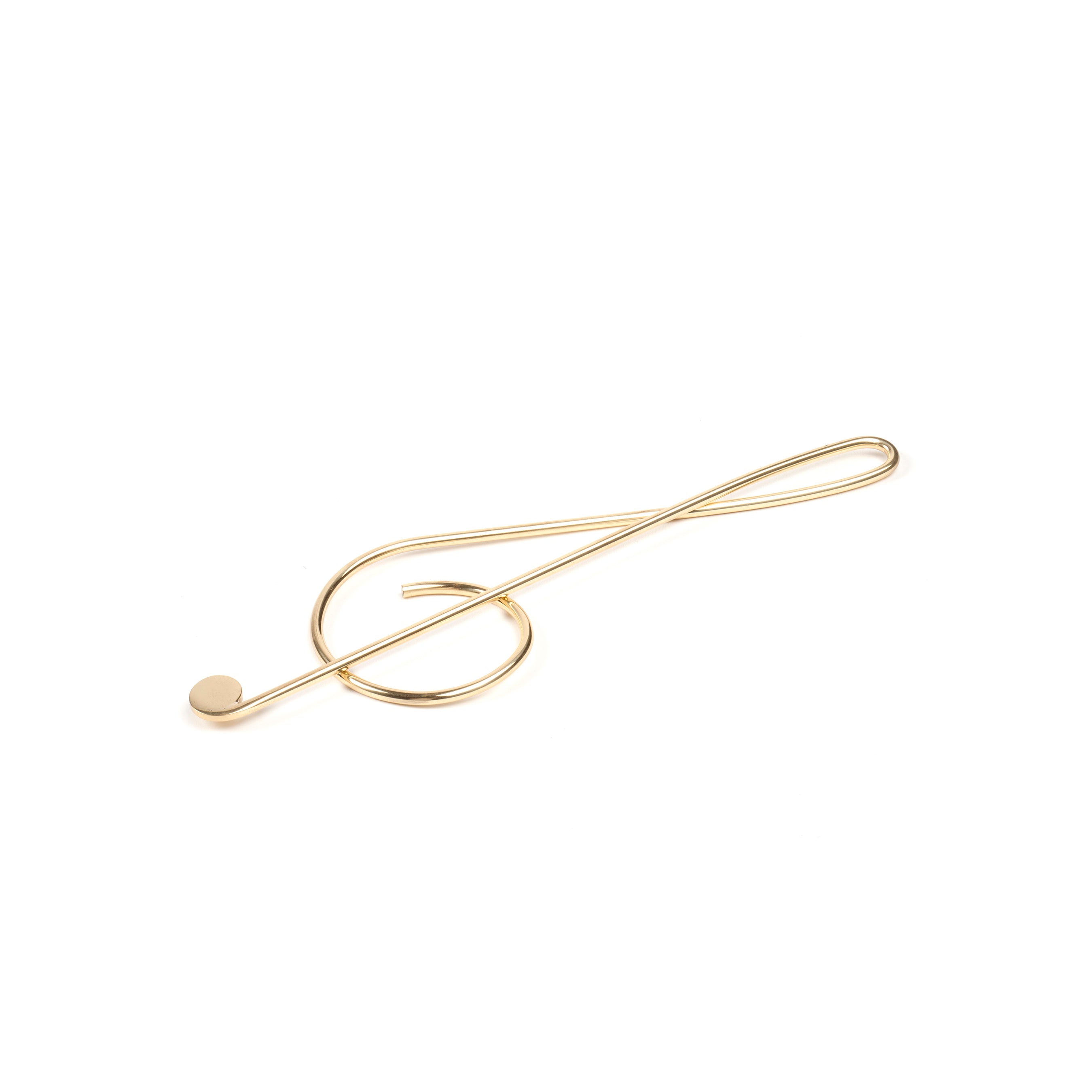 The Werkstätte Carl Auböck Paper Clip Musical Clef #4740 features an elegant brass treble clef design set against a pristine white background.