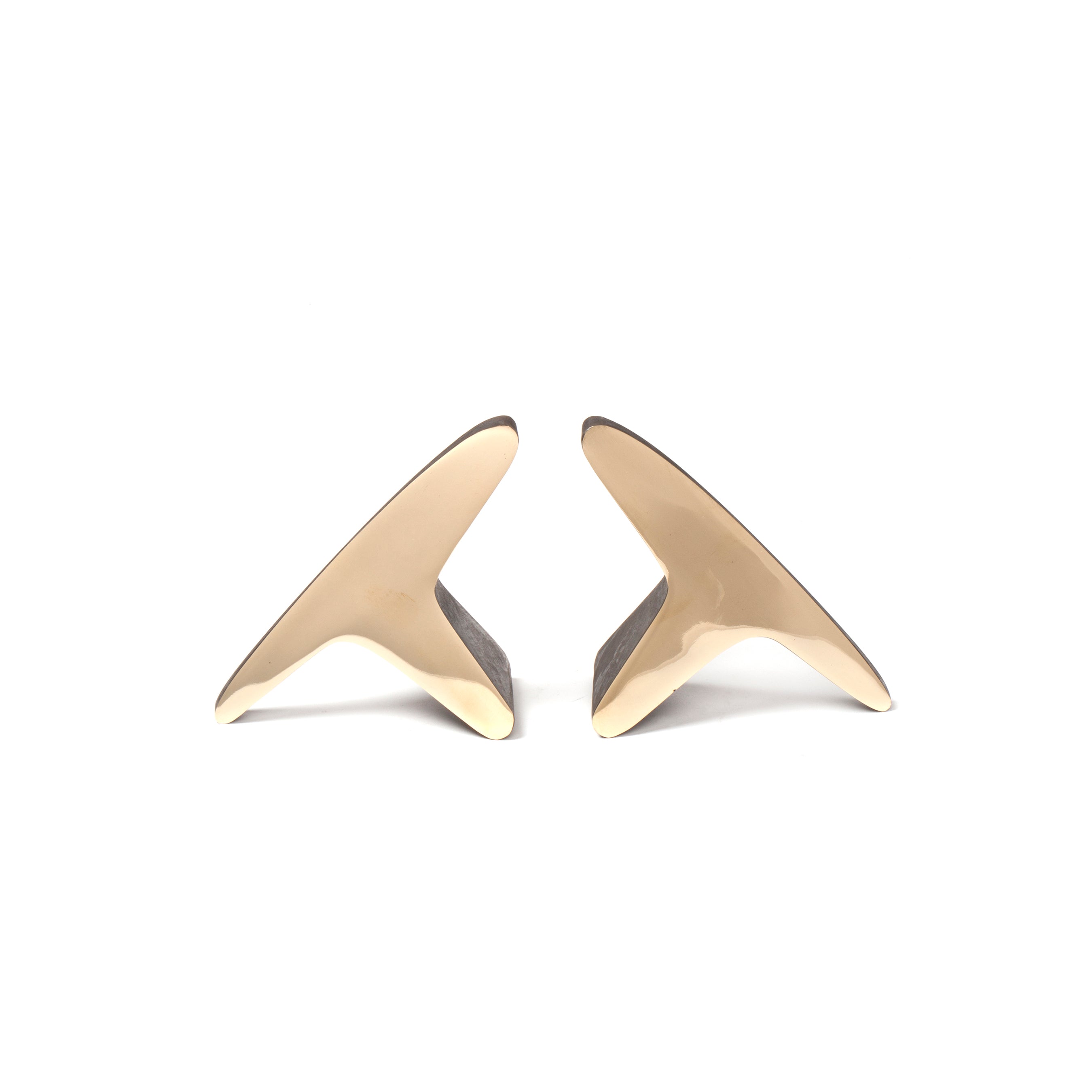 The Werkstätte Carl Auböck Pair of Bookends #3847 are sleek, glossy, gold-toned pieces shaped like bird wings. They evoke the elegance of a Viennese townhouse and the artistry of Wiener Bronzen, beautifully set against a plain white background.