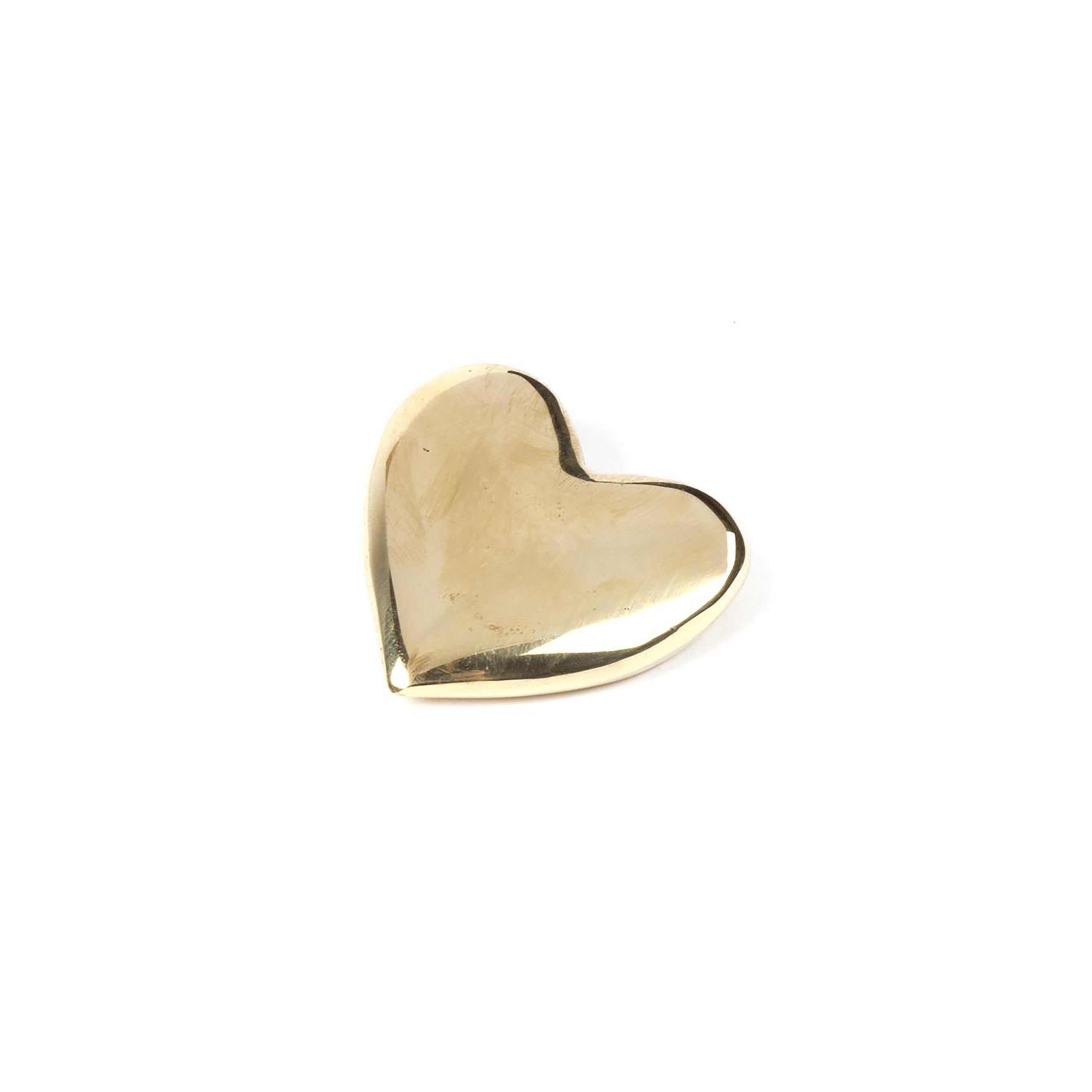 A shiny golden Paperweight Heart #5788 by Werkstätte Carl Auböck, featuring a smooth surface, is elegantly displayed against a plain white background.