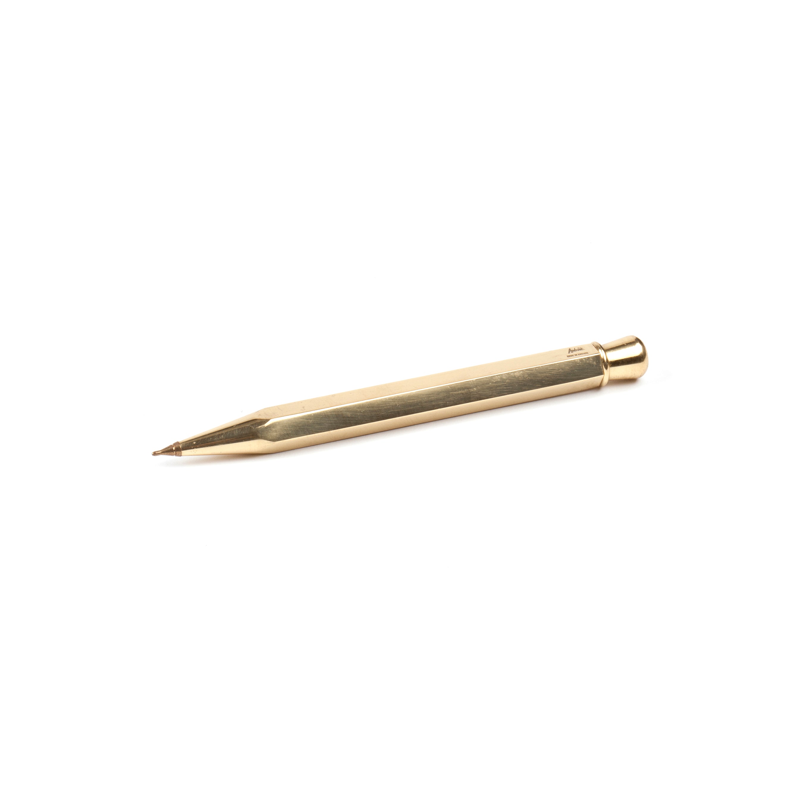 The Ball Point #5037 by Werkstätte Carl Auböck, a brass pen with a sleek bullet design and polished surface, rests on a plain white background, echoing the artistry of iconic Viennese craftsmanship.