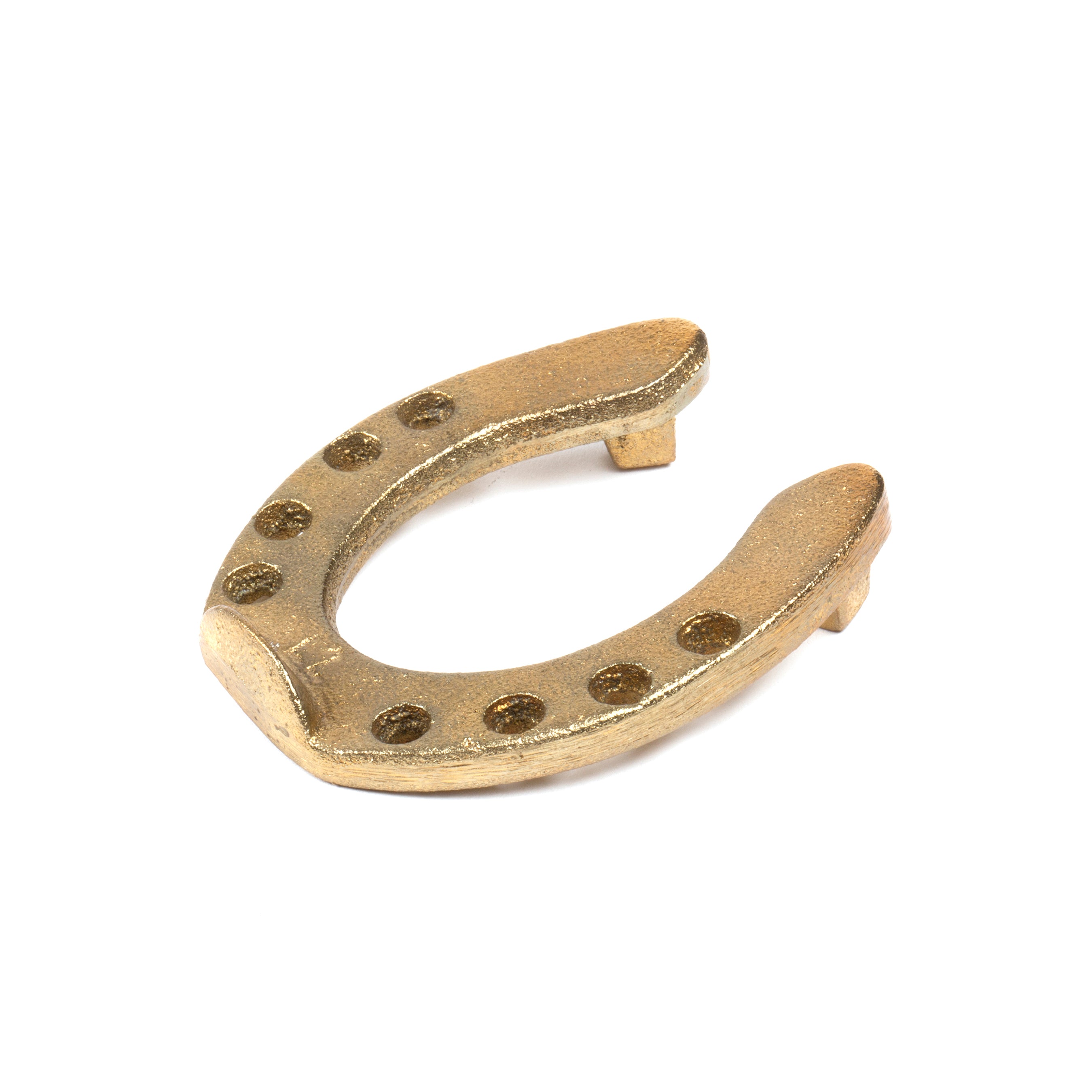 The Pencil Holder Horse Shoe #5138 by Werkstätte Carl Auböck, in a golden hue with eight holes, is elegantly placed facing upwards against a clean white background.