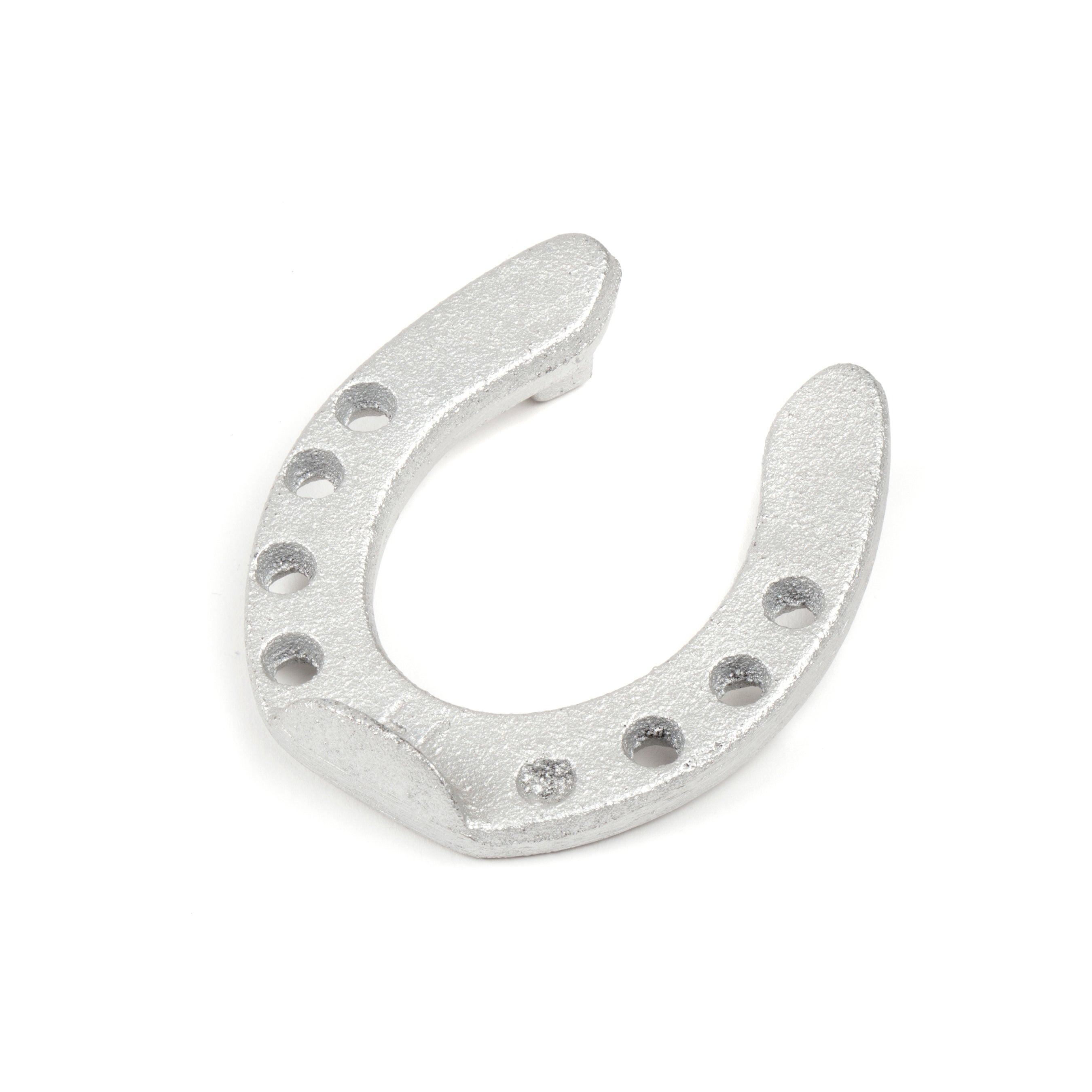 The Pencil Holder Horse Shoe #5138 by Werkstätte Carl Auböck, featuring a classic design with eight holes, is displayed against a plain white background.