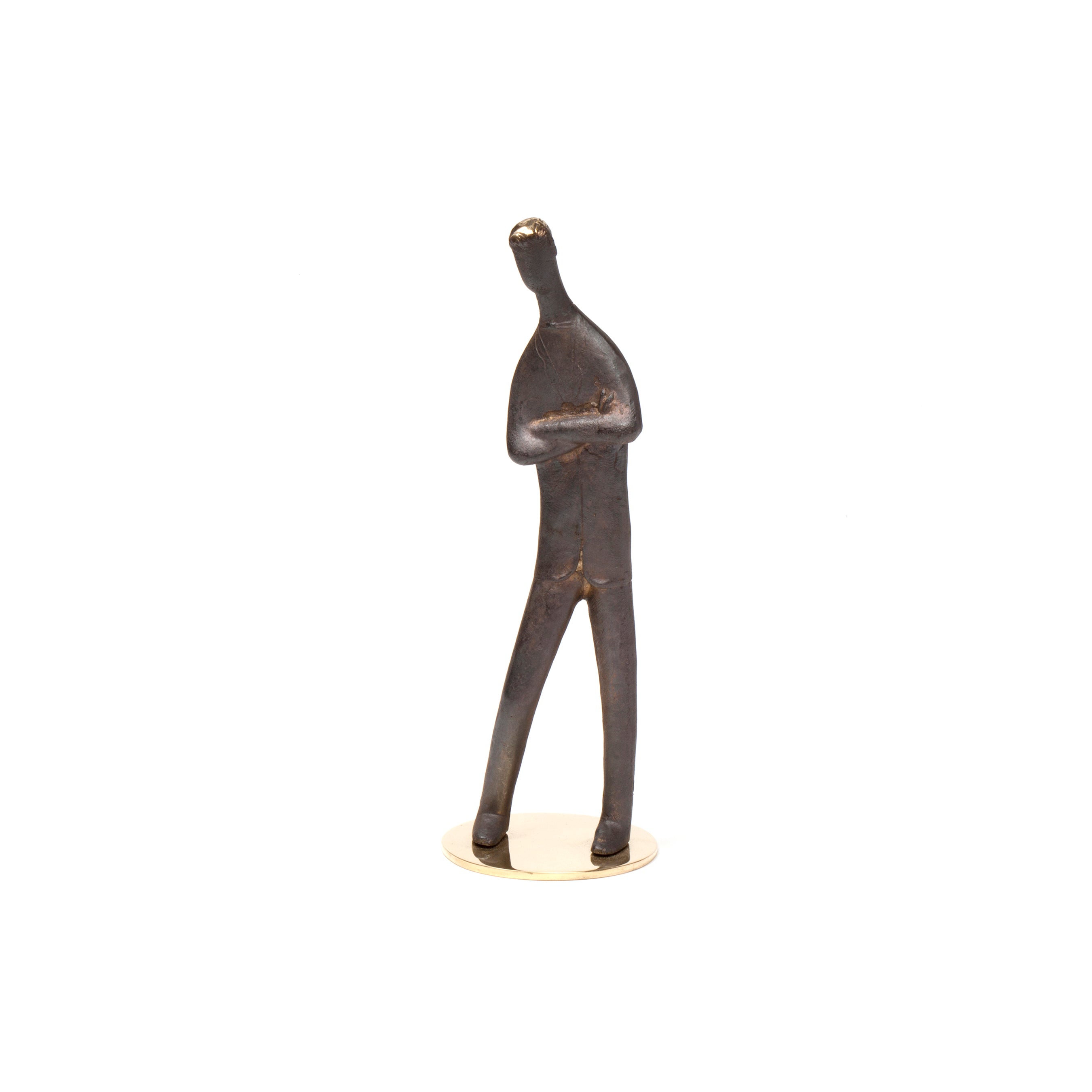 Sculpture My Son #4752 by Werkstätte Carl Auböck is a bronze abstract sculpture of a human figure on a round base, with arms crossed in contemplation or confidence. It features a smooth, dark finish typical of Wiener Bronzen artistry.