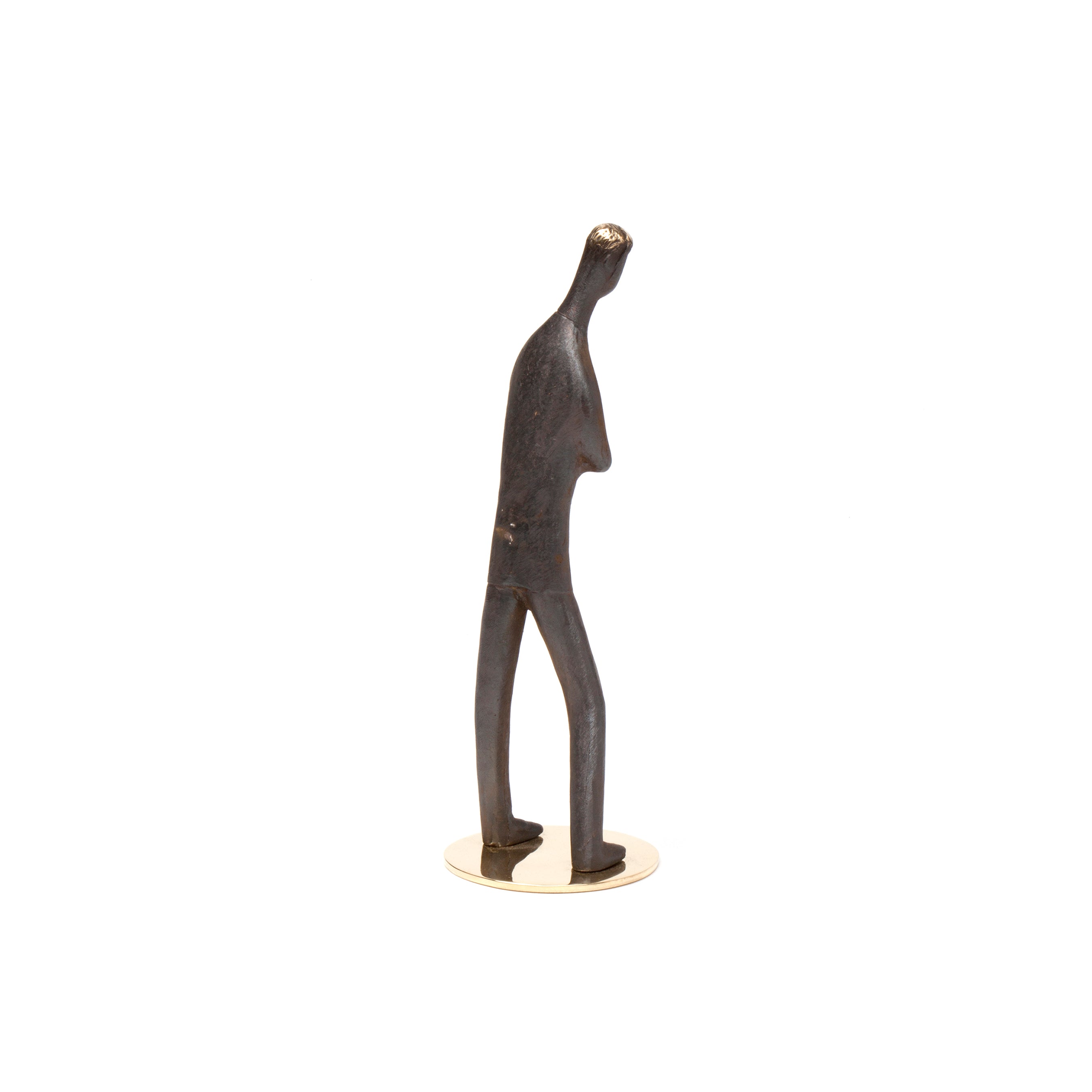 Sculpture My Son #4752 by Werkstätte Carl Auböck is a minimalist metal piece with an abstract human figure, elongated body, and slight forward lean. It has a dark finish and stands on a small circular base, reminiscent of Wiener Bronzen and Carl Auböcks elegant designs.