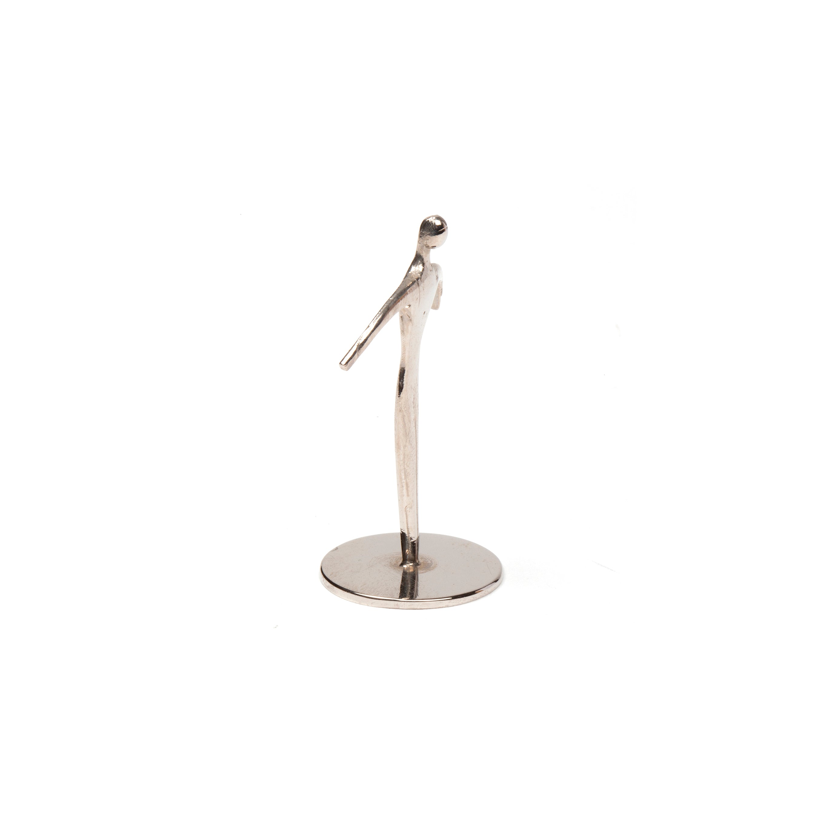 The Sculpture Sportsman #7204 by Werkstätte Carl Auböck is a tall, slender metallic trophy from a Viennese workshop. It features a smooth, abstract human figure with outstretched arms and rounded head on a round base, set against a plain white background, echoing the modern art style.