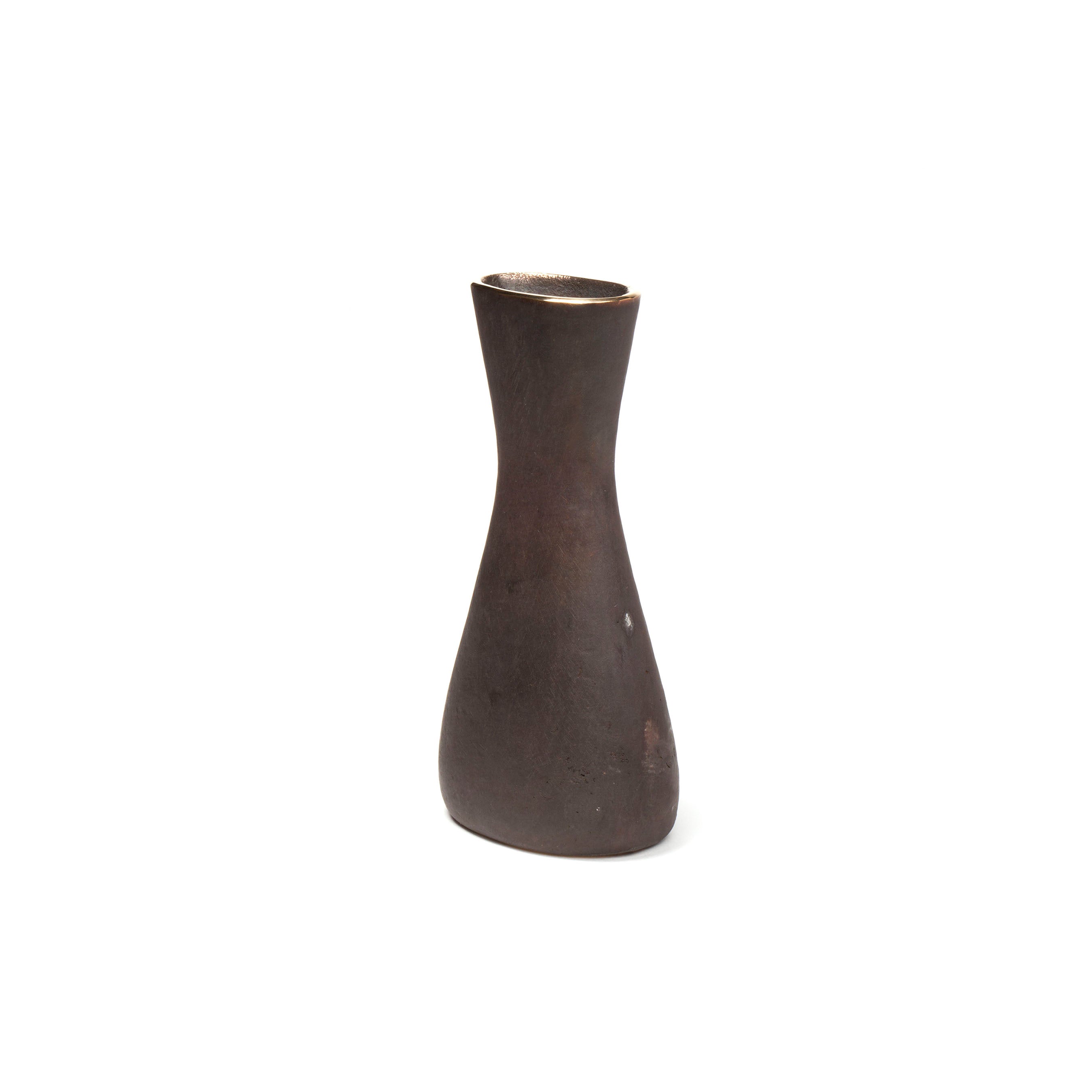 The Vase Taille #7231/1 by Werkstätte Carl Auböck is a tall, narrow, dark brown ceramic piece with a minimalist design, featuring a slightly flared top and subtle asymmetrical bulge at the center against a plain white background.