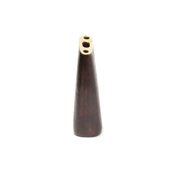 Vase #7235 by Werkstätte Carl Auböck, a tall, conical wooden piece with a flat top and three small brass holes, echoes Carl Auböcks designs. Its dark polished wood and metal accents evoke the elegance of pieces displayed at the 1954 Milan Triennale.