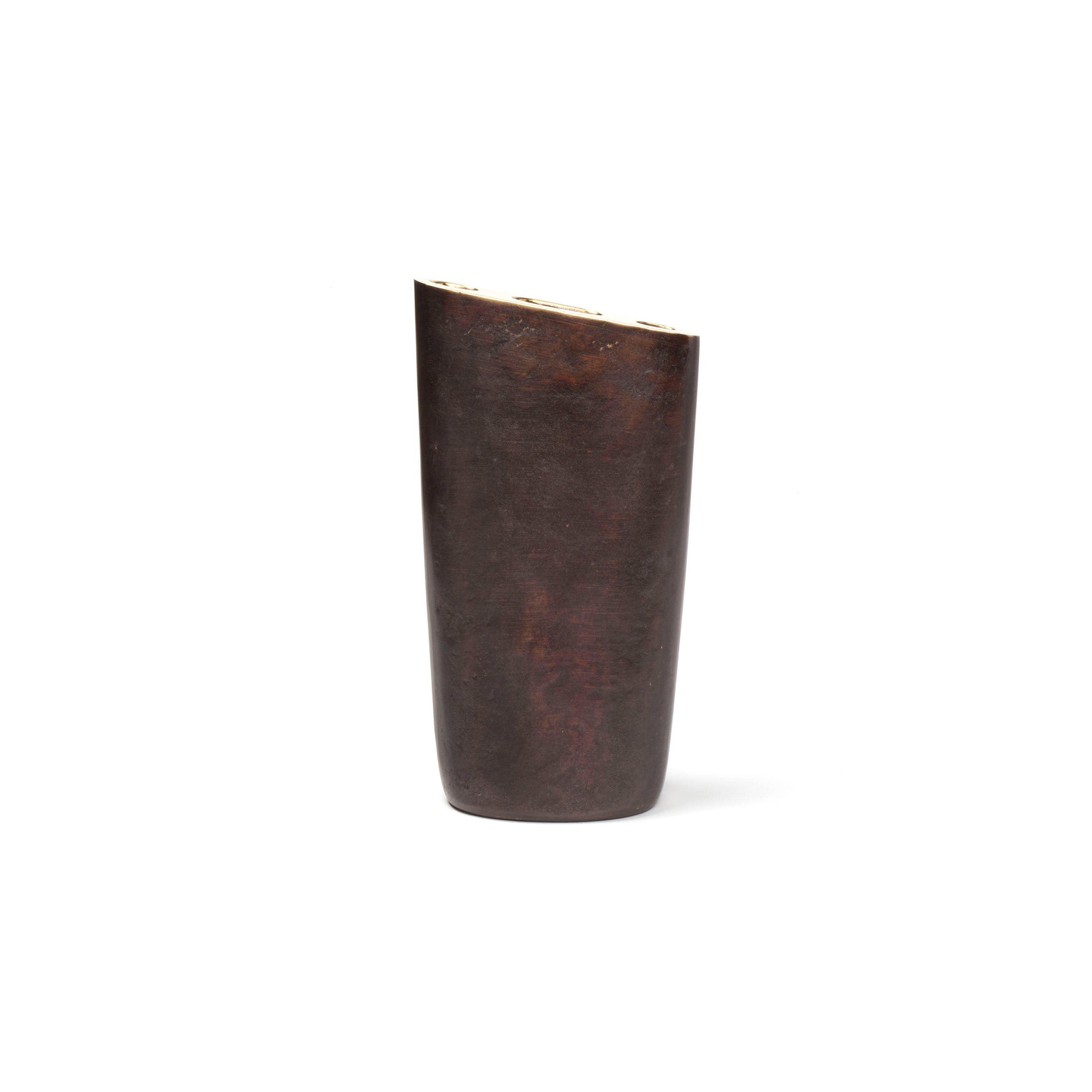 Vase #7235 - Sale by Werkstätte Carl Auböck is a tall, dark brown cylindrical vase with a slightly angled rim against a plain white background, echoing the Viennese workshop design ethos with its smooth, polished surface.