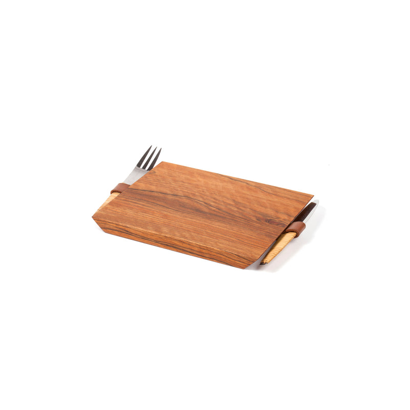The Walnut Board with Knife and Fork #4363-1 by Werkstätte Carl Auböck, elegantly displayed on a white background, features stunning wood grain with neatly slotted knife and fork on the sides.