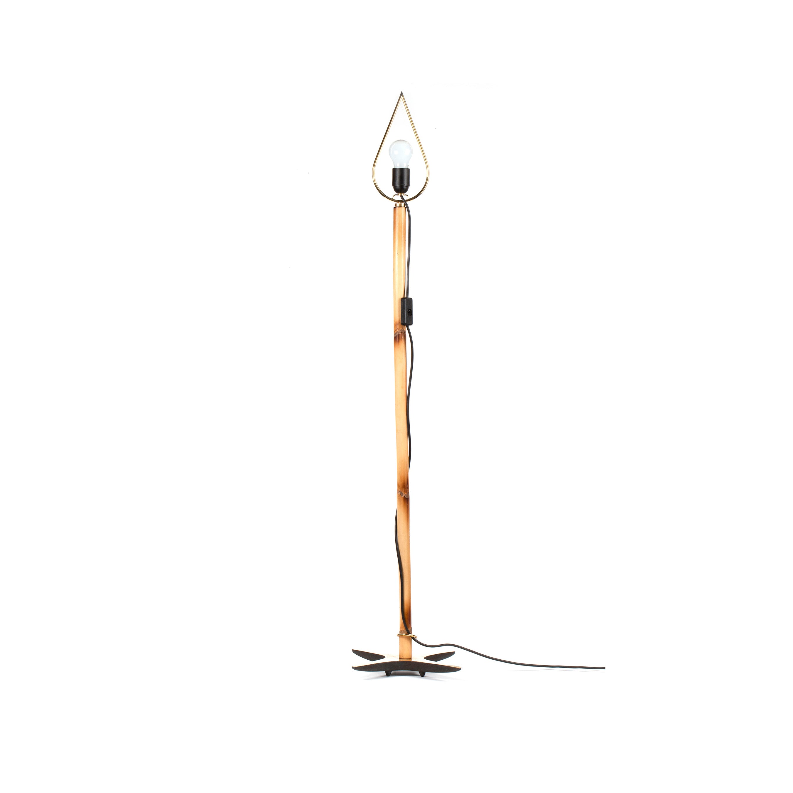 The X-Lamp #3881 by Werkstätte Carl Auböck is a tall, slender floor lamp with a teardrop-shaped frame and metal stand in warm copper, anchored by a dark star-shaped base. Its visible bulb adds elegance to any room and comes with an attached power cord.