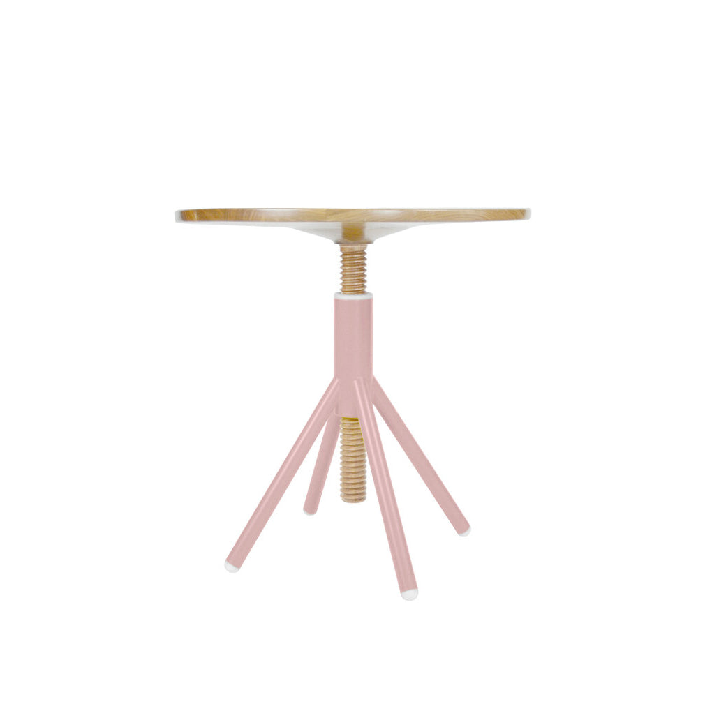 The Thread Family - Bistro Table by Coordination Berlin is a minimalist piece with a height-adjustable round walnut top and a pink welded steel base, complemented by three elegantly angled legs.